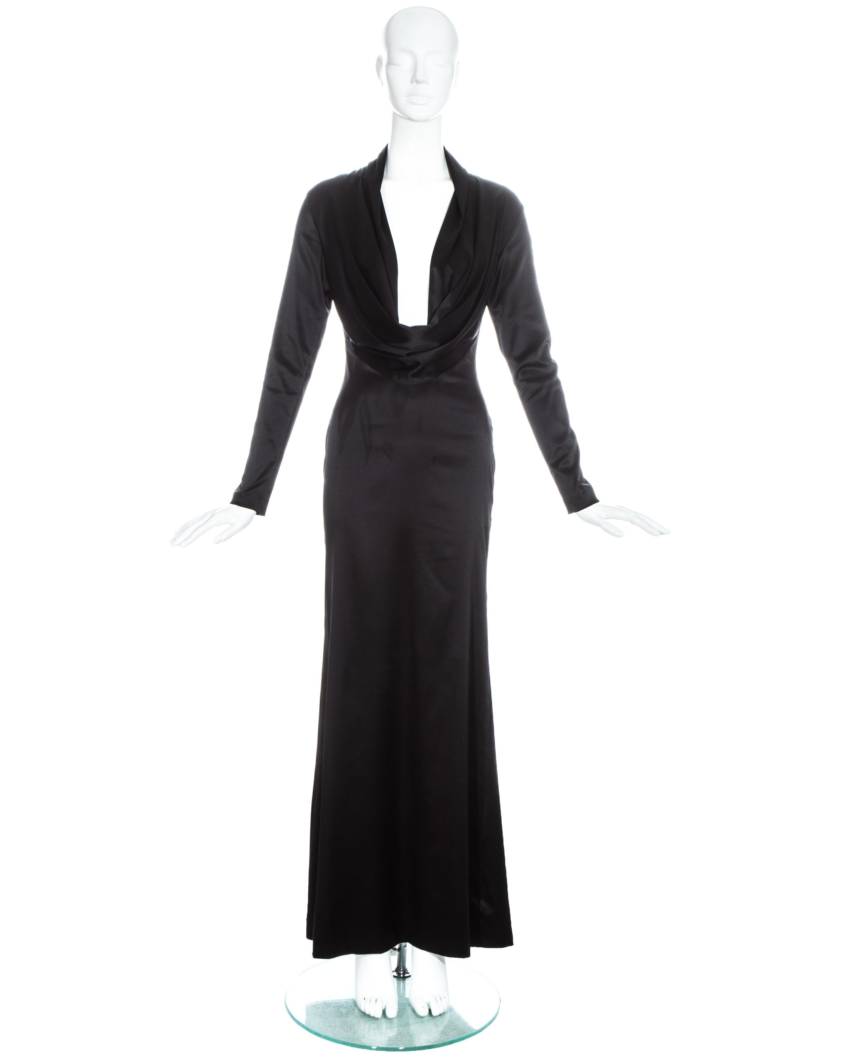 Alexander McQueen black evening maxi dress with draped low plunge neckline.

Fall-Winter 1998