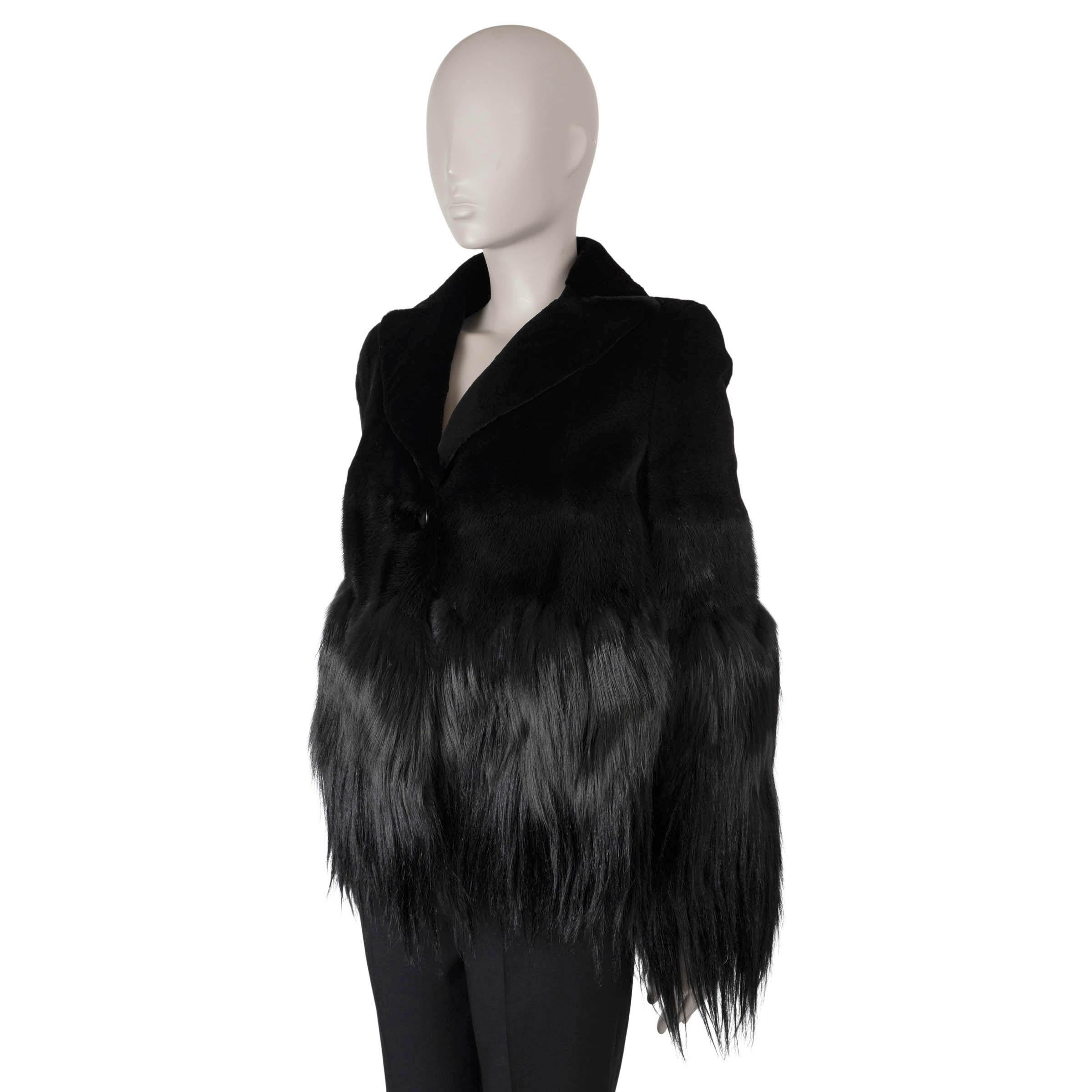 This 100% authentic Alexander McQueen fur jacket is an exceptional piece, crafted from luxurious black sheared mink with a striking fox fur waist and long hair shearling at the bottom. Featuring elegant peak lapels and two discreet pockets, this