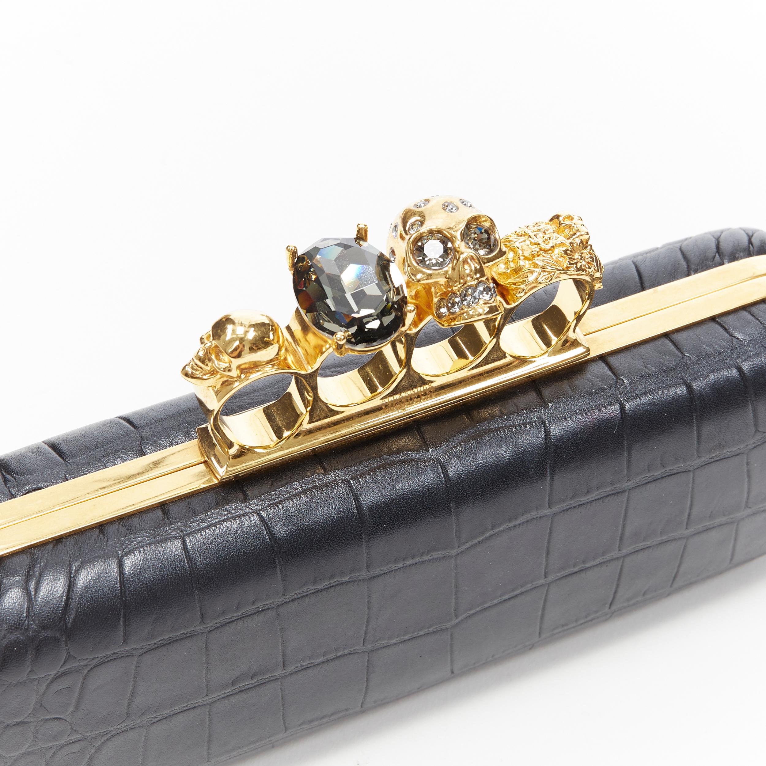 ALEXANDER MCQUEEN black mock croc gold skull knuckleduster box clutch bag
Brand: Alexander McQueen
Model Name / Style: Box clutch
Material: Leather, metal
Color: Black
Pattern: Solid
Closure: Clasp
Extra Detail: Black stamped mock croc leather