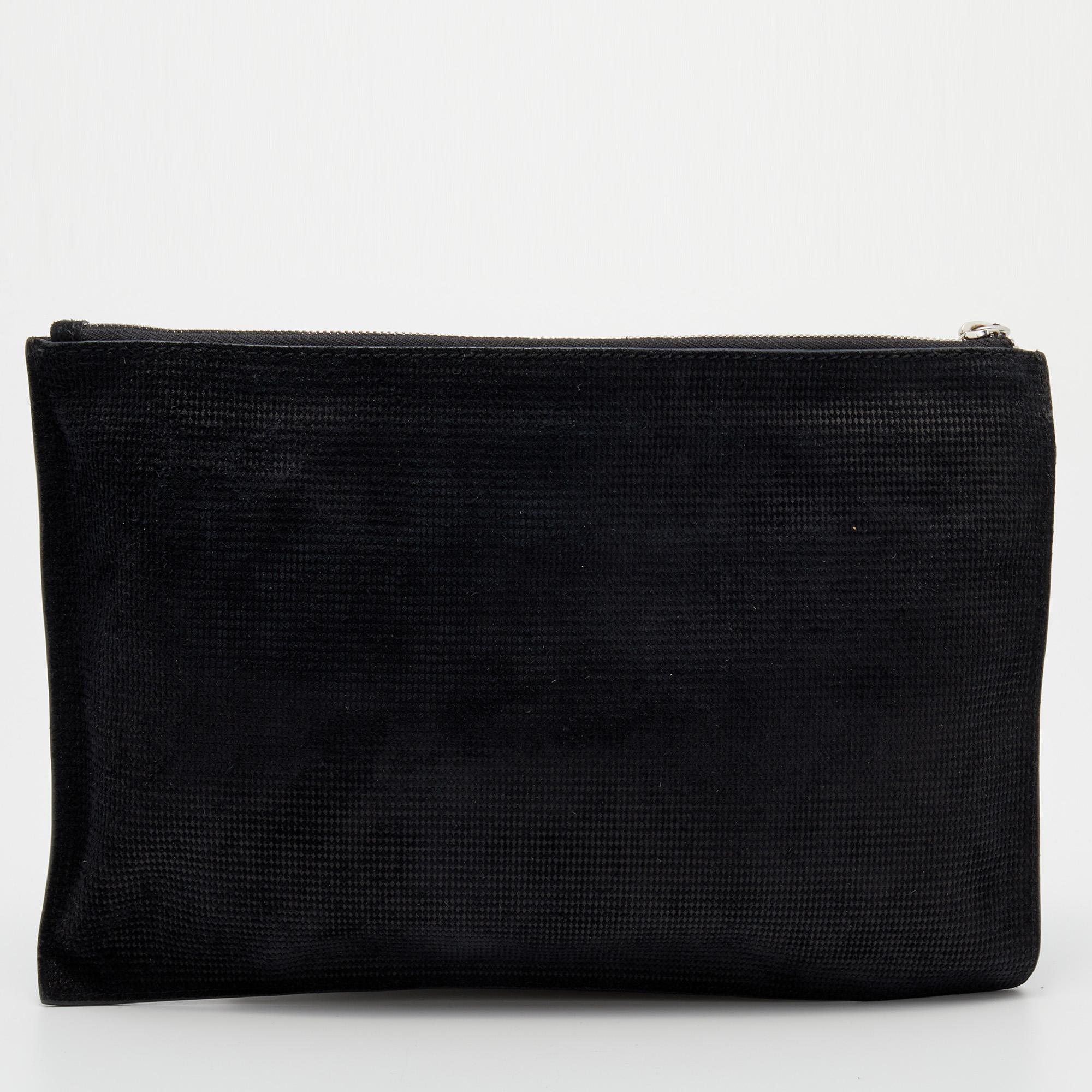 If you love to travel light, then this Alexander McQueen clutch is the apt choice for you. Made from nubuck leather, its top zipper closure secures the canvas-lined interior and it is added with an eye-catching wristlet.

Includes: Info Booklet