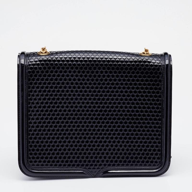 Treat yourself to this Heroine bag from Alexander McQueen. Crafted from honeycomb-pattern patent leather, the bag has a flap closure, suede interior, and gold-tone hardware. The strap allows multiple carry options.

Includes: Original Dustbag