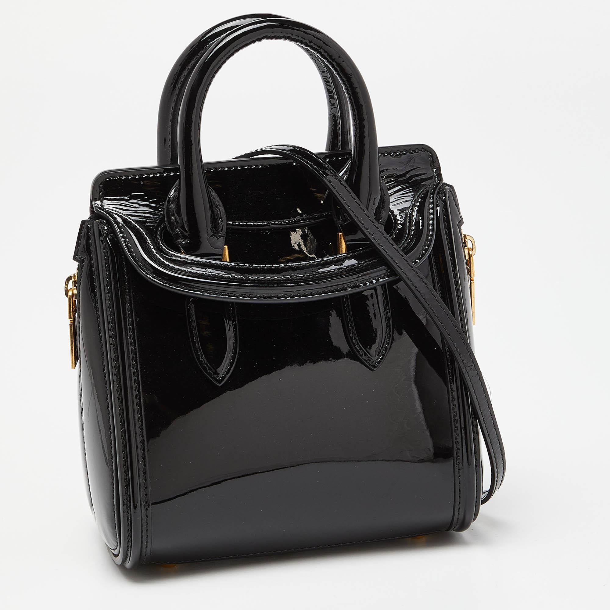 This Alexander McQueen satchel is built to hold your essentials most fashionably! Easy to style, well-made using the best materials, and coming from the top brand, the satchel will add immense style to your ensemble.


