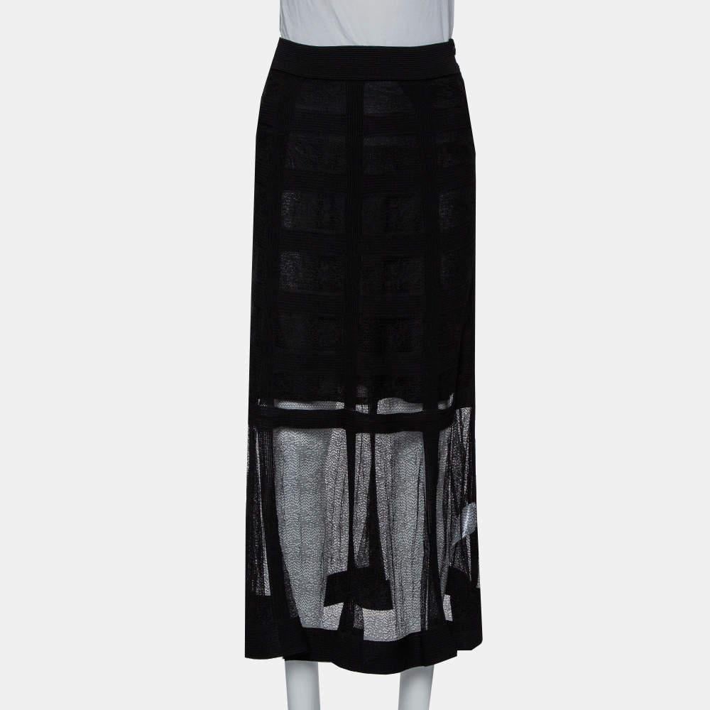 A fashionable midi skirt by Alexander McQueen that you can pair with a tailored top or blazer and chic shoes. Designed with a sheer overlay, it has a mini-skirt lining inside and a zip closure.

Includes: rand Tag
