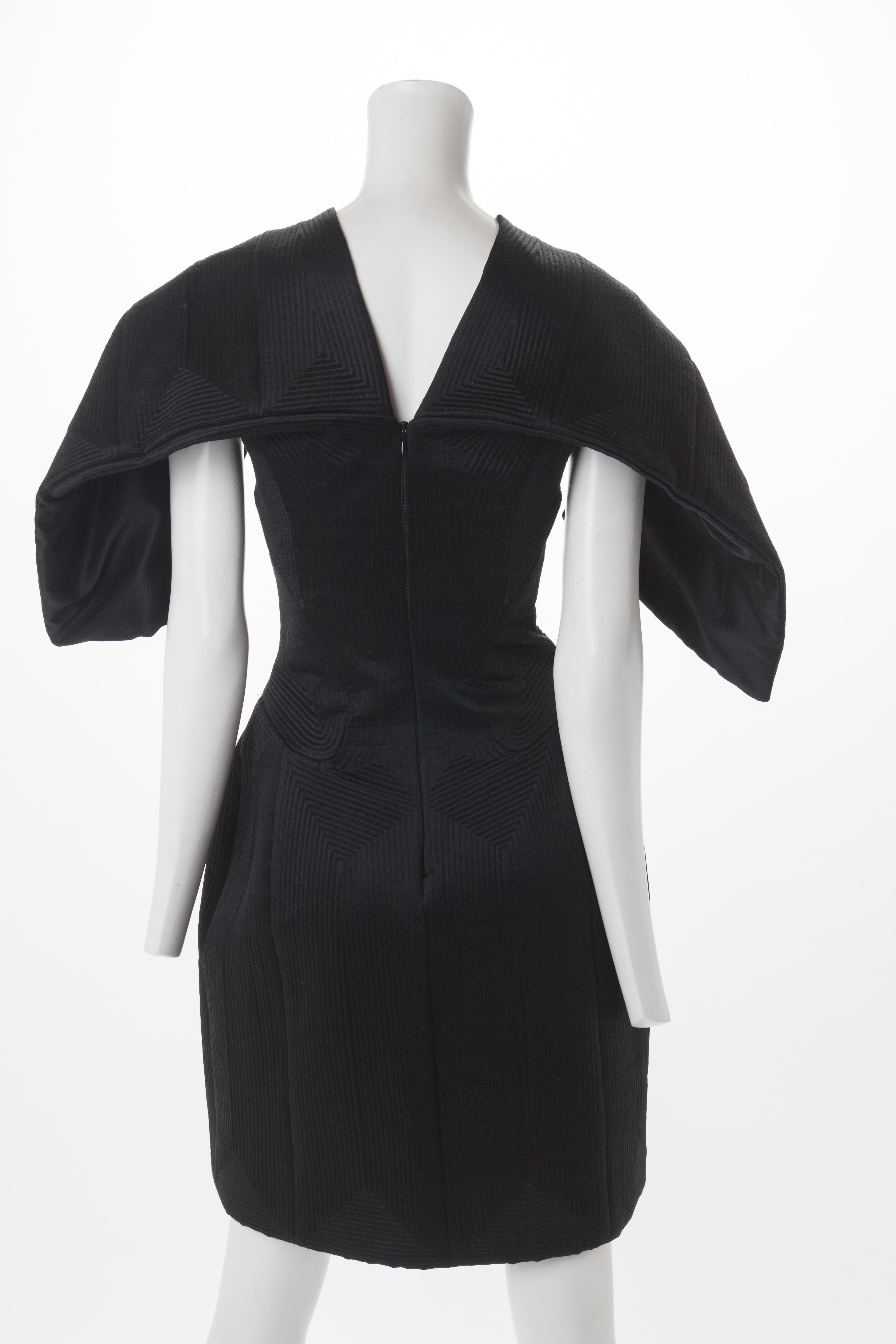 Women's Alexander McQueen Black Quilted Satin Cocktail Dress with Batwing Sleeves, 2009.