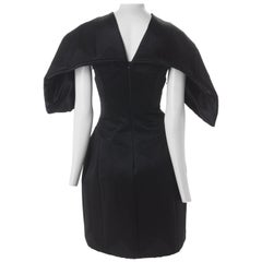 Alexander McQueen Black Quilted Satin Cocktail Dress with Batwing Sleeves, 2009.