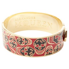 ALEXANDER MCQUEEN black red skull enamel gold tone brass bangle cuff
