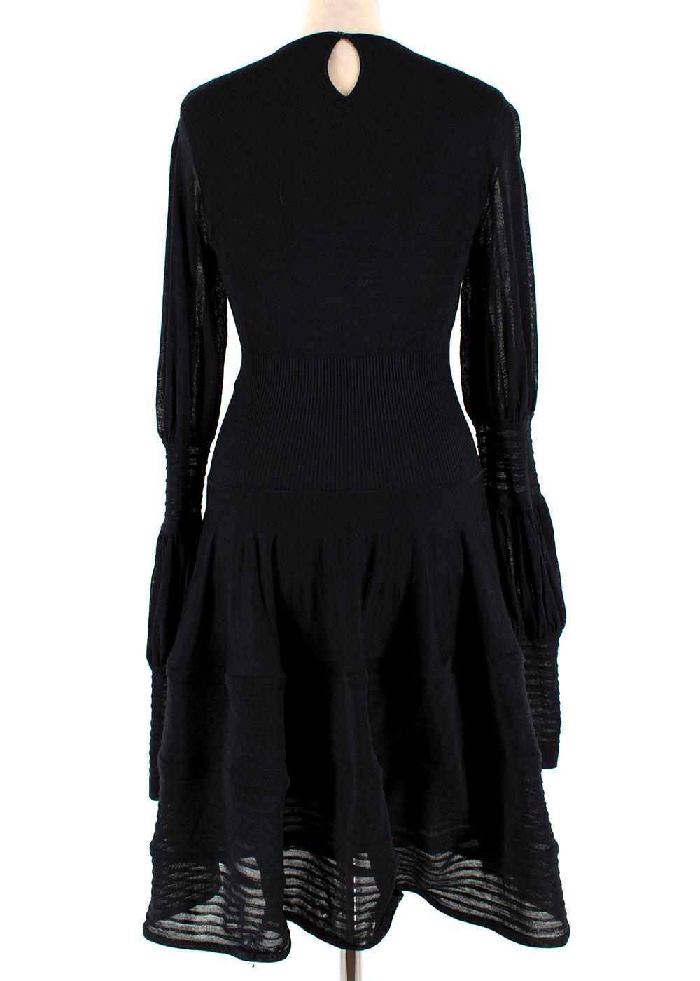 Alexander McQueen Black Ribbed Silk Dress

- Ribbed detail dress
- Cuffed sleeves 
- Button fastening
- Lined hem 
- Silk slip 
- Fitted style 
- Size M 

Dry Clean Only 

Shoulders - 41cm 
Sleeves - 82cm
Chest - 41cm
Waist - 20cm
Length - 205cm 

