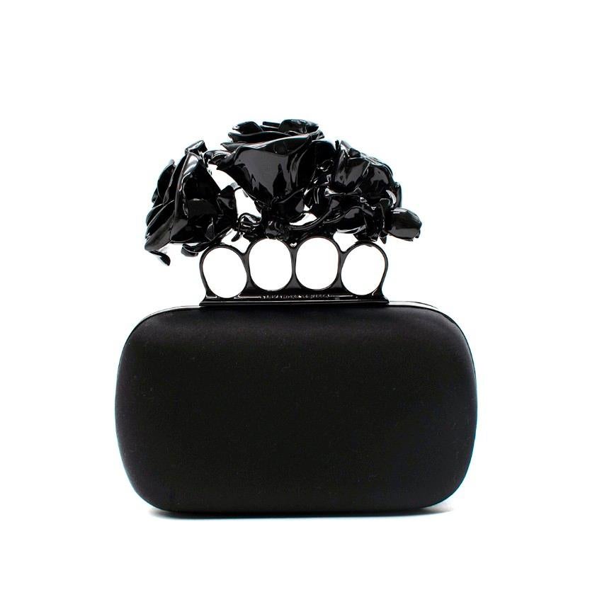  Alexander McQueen Black Satin 3D Enamel Roses Knuckle Clutch
 

 - Darkly romantic itineration of the cult McQueen Knuckle clutch, featuring a silk satin wrapped box clutch, with hinged opening, topped with a black enameled metal 4-ring knuckle