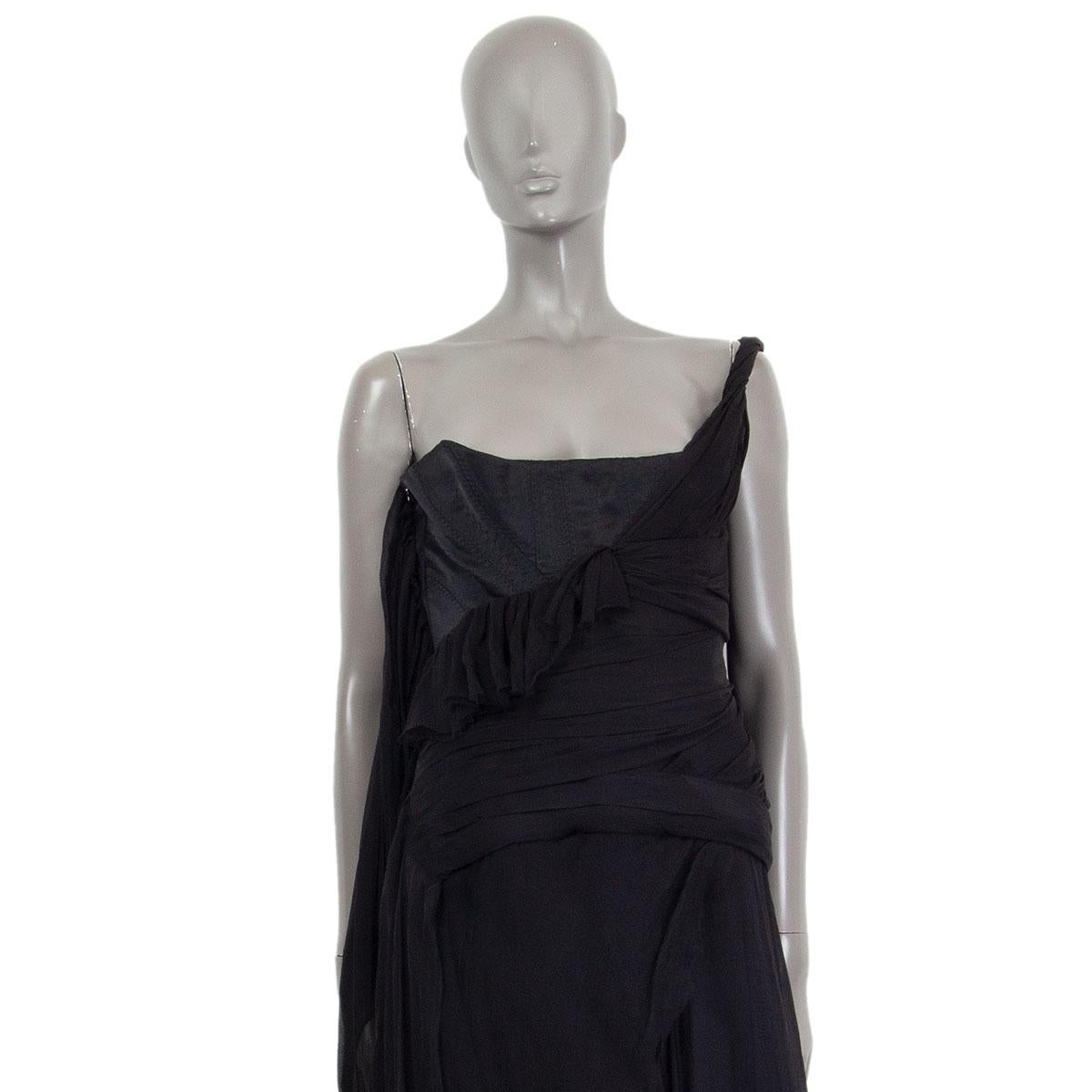 Alexander McQueen bustier layered chiffon dress in black silk (100%) with a one shoulder strap. Has a metal decorative buckle on the strap. Closes on the side with a concealed zipper. Lined in a silk blend (assumed as not mentioned on content tag).