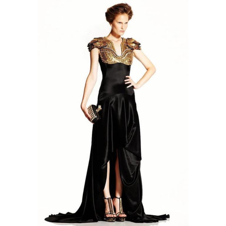 Alexander McQueen - (Made in Italy) Black silk dress, top embroidered with metallic pastilles, rhinestones, and pearls. Size 46IT indicated, it fits a 42FR. 2011 Resort Collection.

Additional information:
Condition: Very good condition
Dimensions: