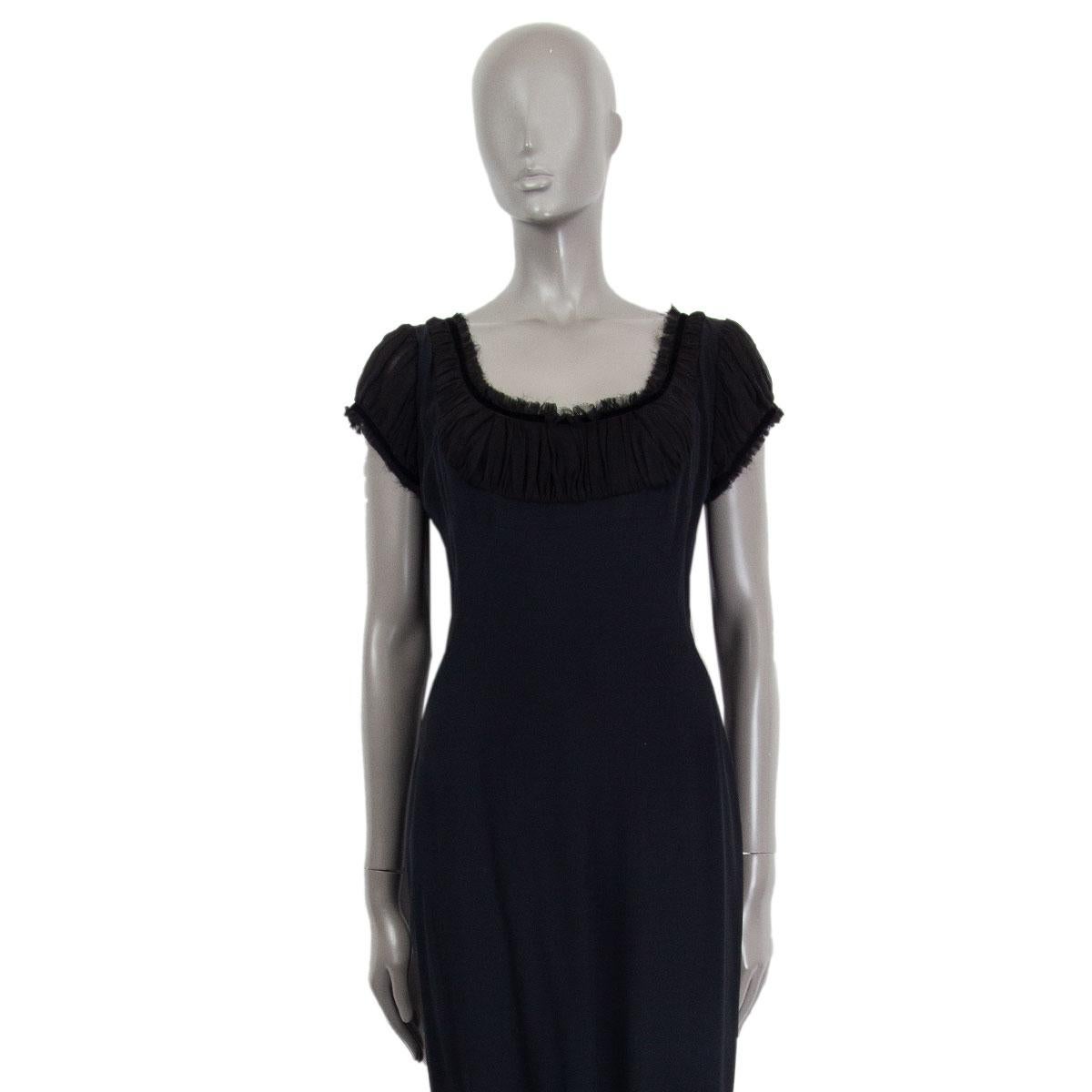 Alexander McQueen gathered short sleeve sheath dress in black acetate (45%), viscose (45%) and silk (10%) with a wide neck. Closes on the back with a concealed zipper. Lined in acetate (74%) and silk (26%). Has been worn and is in excellent