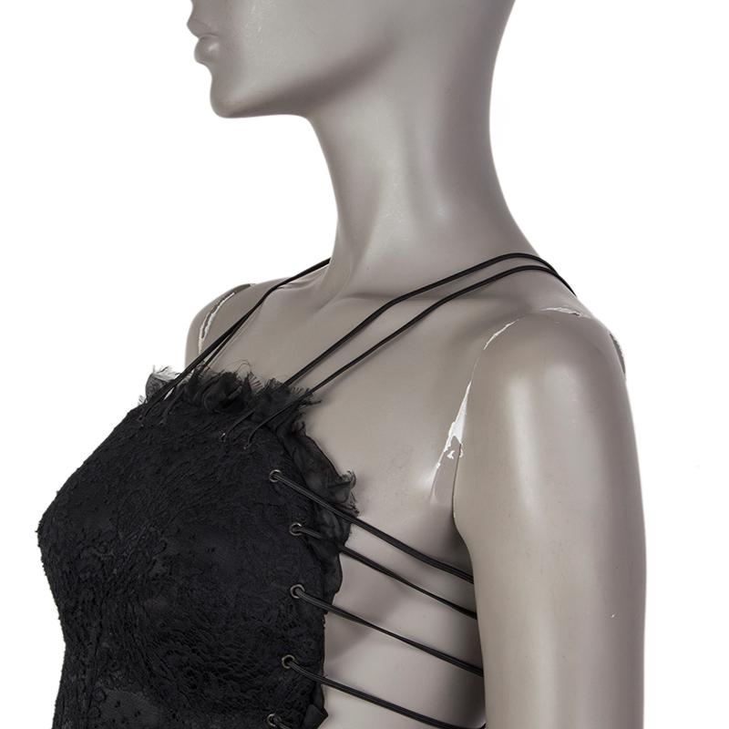 Alexander McQueen lace bustier dress in black silk (38%), cotton (32%), polyester (15%), nylon (13%), and acetate (2%). With shoulder straps, fray ruffled trim, lace-up back, and trumpet skirt. Closes with invisible zipper on the back. Lined in