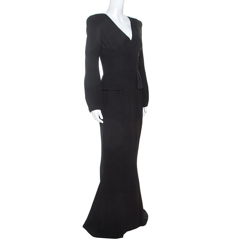 Turn heads when you wear this Alexander McQueen gown that gives a sophisticated edge to your personality. This ensemble in black color is the right fusion of elegance and comfort as it smoothly takes you through the evening. It is styled with a V