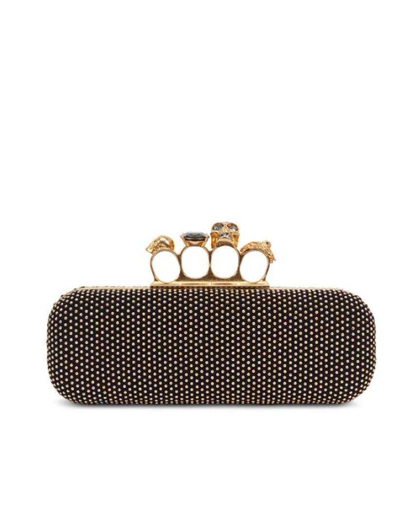 Alexander McQueen

Alexander McQueen Skull Original Black Clutch made in black suede. The small rectangular model has a single compartment with main closure by a skull-shaped snap-on device with beaded details on the eyes and teeth of the skull and
