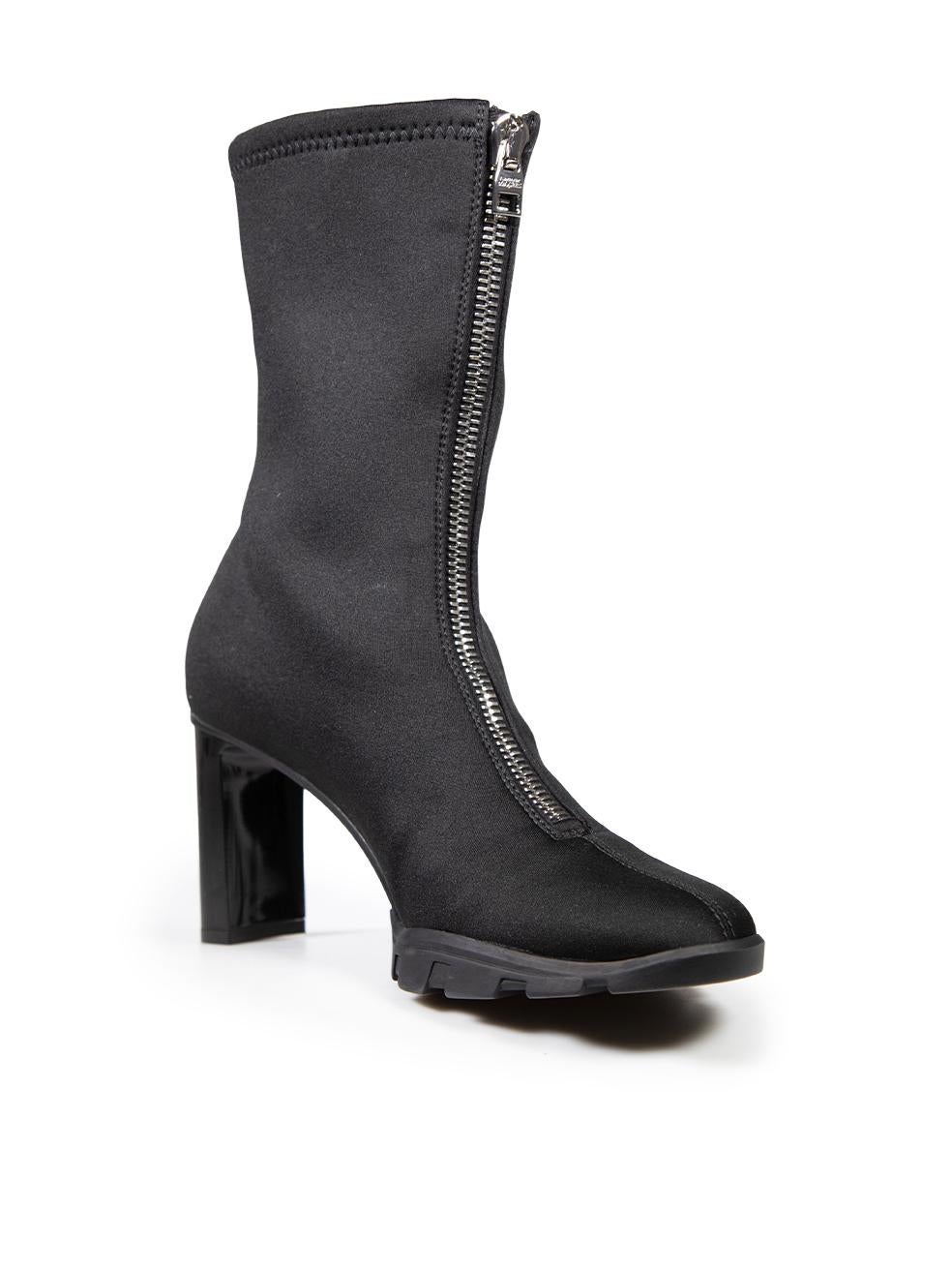 CONDITION is Very good. Minimal wear to boots is evident. Minimal wear to the heel counters and on heel tips with light abrasion on this used Alexander McQueen designer resale item.

Details


Black

Cloth textile

Boots

Round toe

Mid calf

Sock