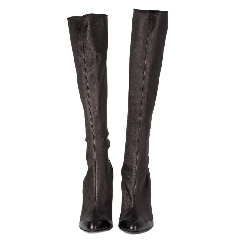 100% authentic Alexander McQueen knee-high boots in black stretchy leather. Band new. Come with dust-bag. 

Measurements
Imprinted Size	39.5
Shoe Size	39.5
Inside Sole	26cm (10.1in)
Width	7.5cm (2.9in)
Heel	12cm (4.7in)
Shaft	41cm (16in)
Top