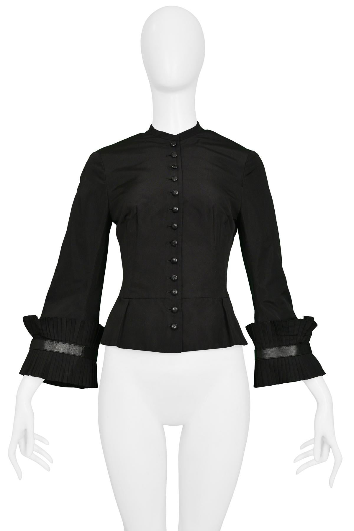Resurrection Vintage is excited to offer an Alexander McQueen black taffeta jacket featuring pleated flared sleeves, a short peplum, and a button closure at the front.  from the Autumn/Winter 2002 “SUPERCALIFRAGILISTICEXPIALADOCIOUS” Runway
