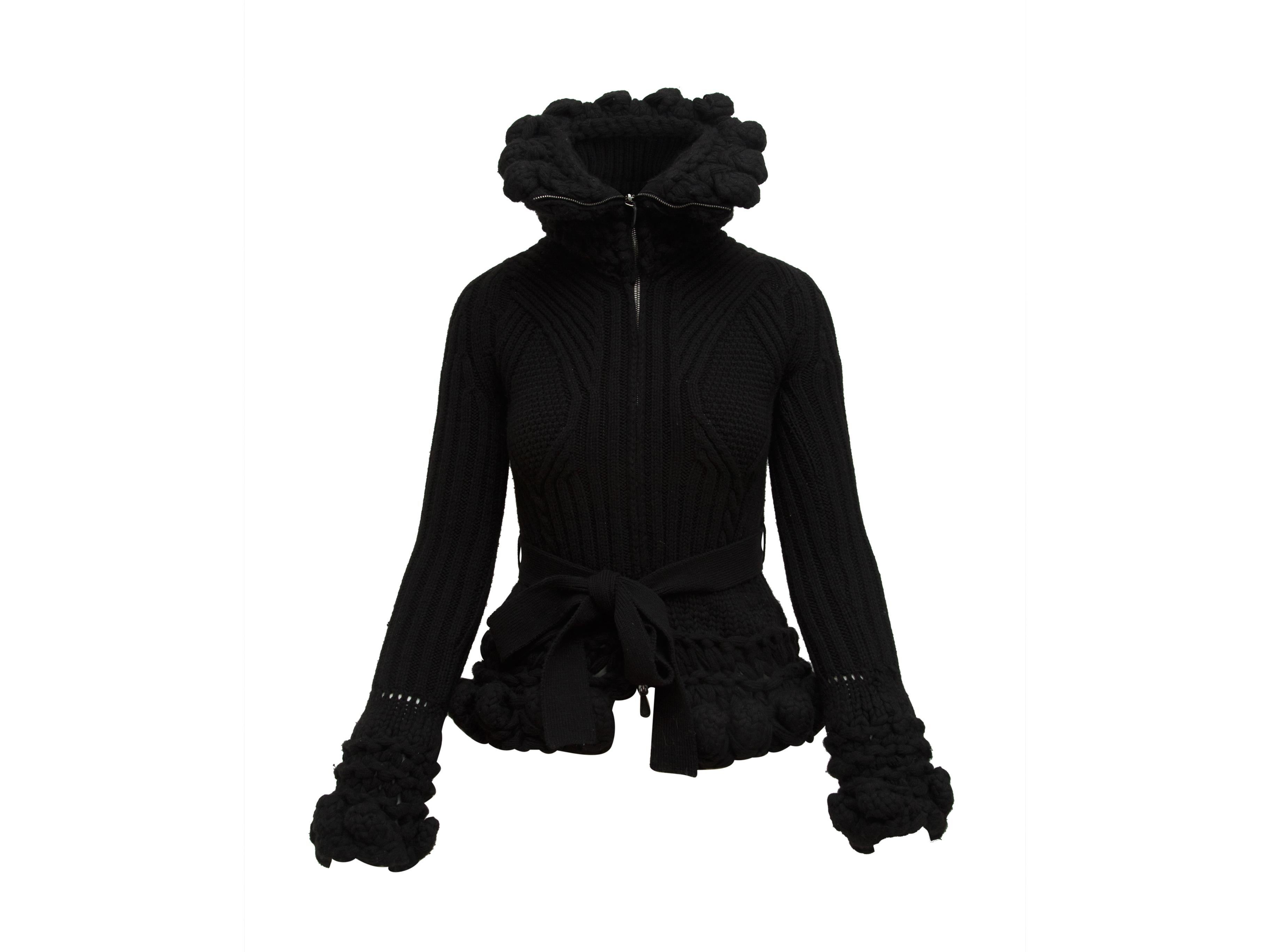 Product details:  Black turtleneck knit jacket by Alexander McQueen.  Long sleeves.  Zip-front closure.  Self-tie waist.  32