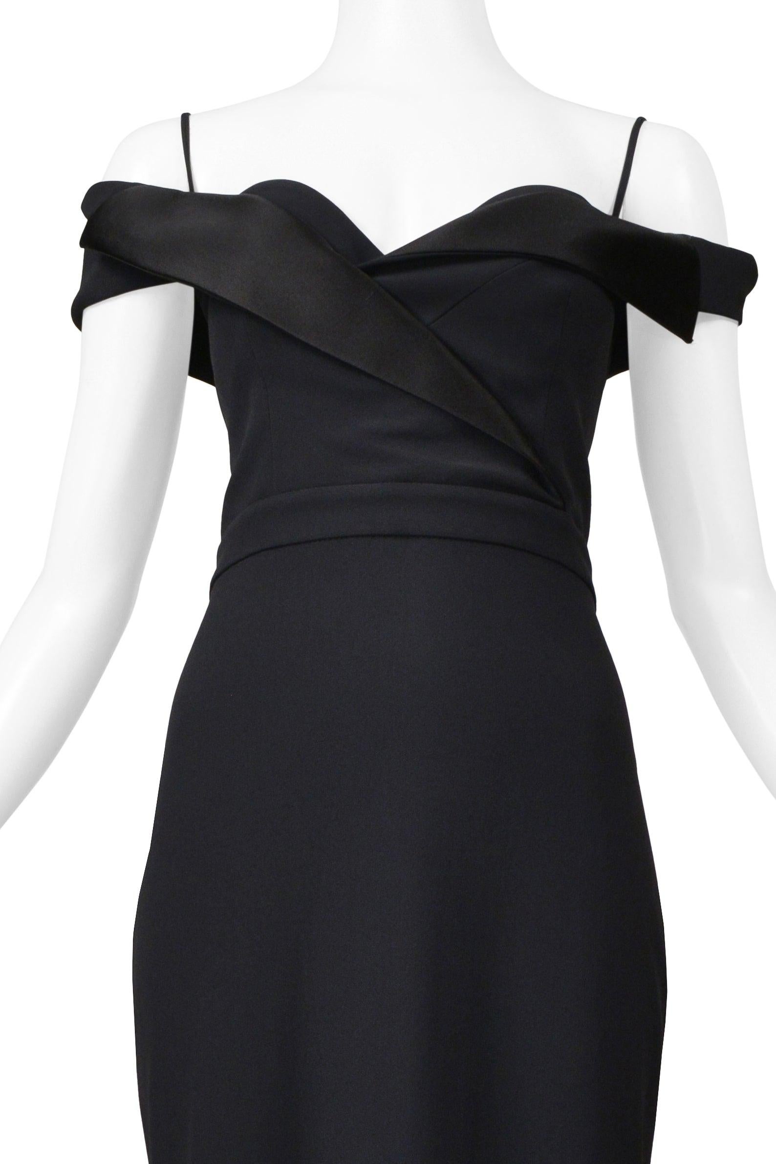 Resurrection Vintage is excited to offer an Alexander McQueen black tuxedo dress featuring a cold shoulder exposed neckline with straps, a double-breasted bodice with classic satin tuxedo details, a center back zipper closure, and gown length. 

*