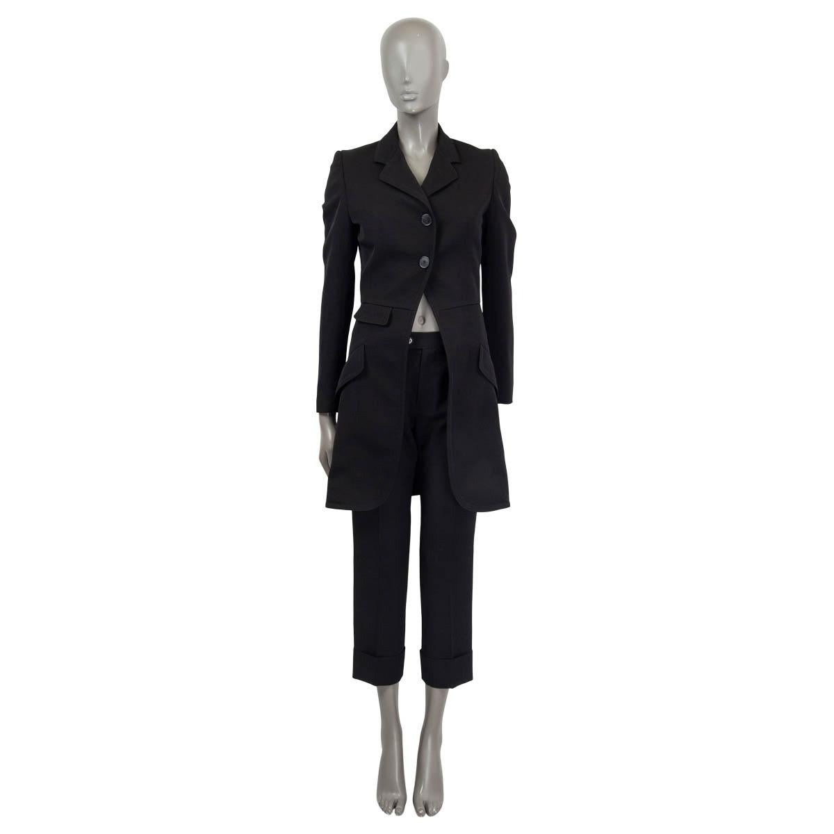 100% authentic Alexander McQueen redingote coat in black wool and viscose (assumed cause tag is missing). Features buttoned cuffs, padded shoulders and three sewn shut flap pockets on the front. Opens with two buttons on the front. Lined in black