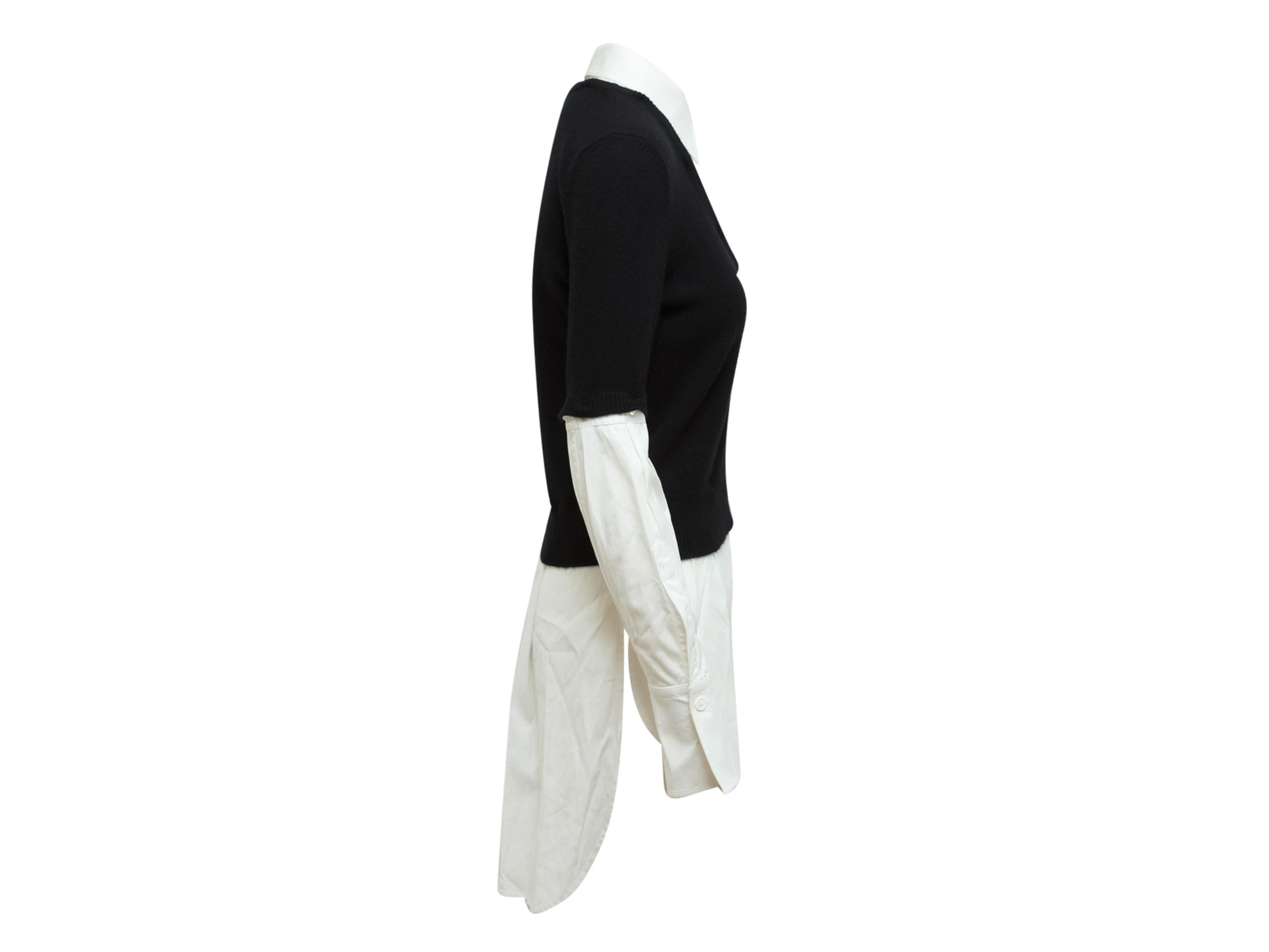 Product details: Black and white layered wool and cashmere sweater by Alexander McQueen. V-neck. Long sleeves. Detachable underlay featuring pointed collar. 38