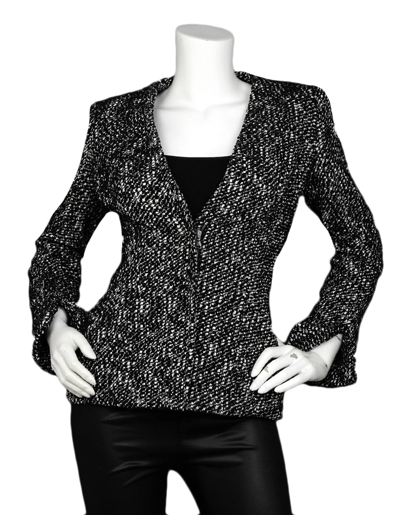 Alexander McQueen Black & White Tweed Front-Zip Jacket sz 40

Made In: Italy 
Color: Black, White
Materials: 80% Polyamide, 16% Cotton, 3% Viscose, 1% Polyester
Lining: 71% Acetate, 29% Silk
Opening/Closure: Front zip
Overall Condition: Excellent