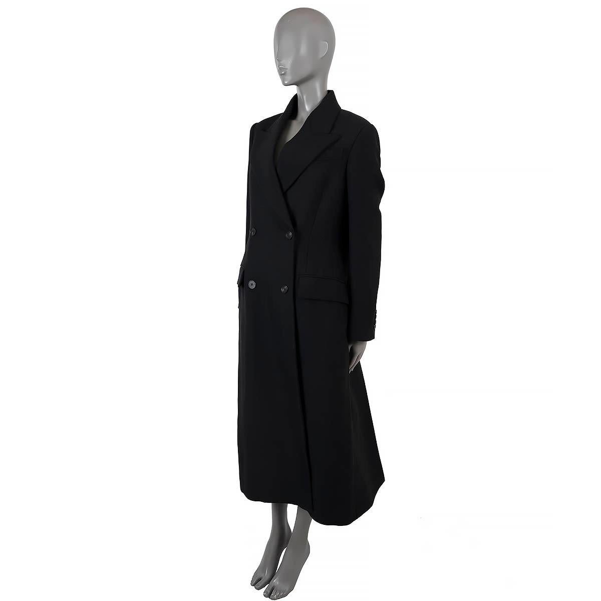 100% authentic Alexander McQueen double-breasted coat in black wool (75%) and polyamide (25%). Features a long, tailored silhouette with lace-up detail in the back, that beautifully cinches the waist, peak lapels and two flap pockets at the waist.