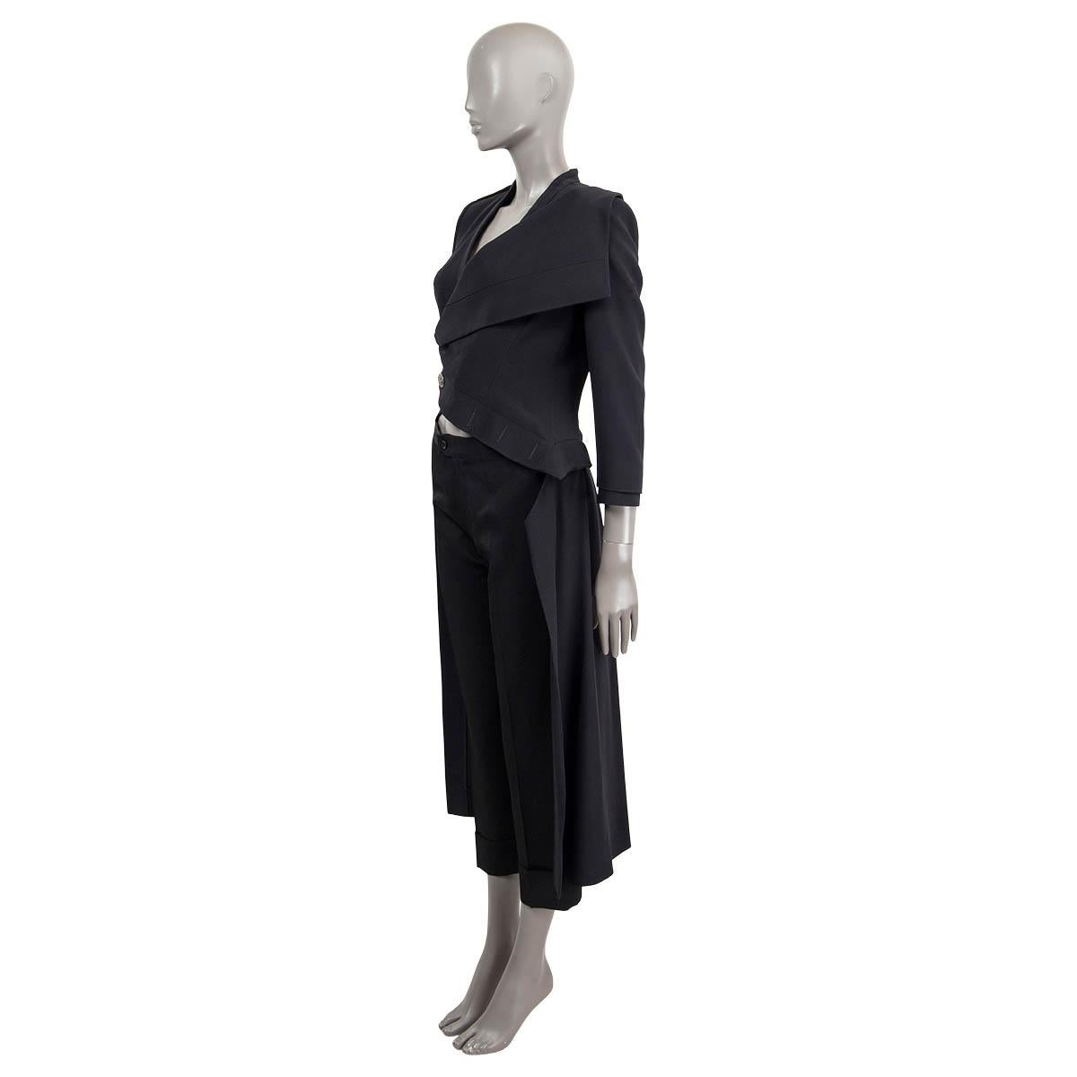 100% authentic Alexander McQueen long asymmetrical tuxedo blazer in black acetate (50%) and viscose (50%). Features padded shoulders and one epaulette on the shoulder. Opens with silver-tone buttons and a concealed push button on the front.