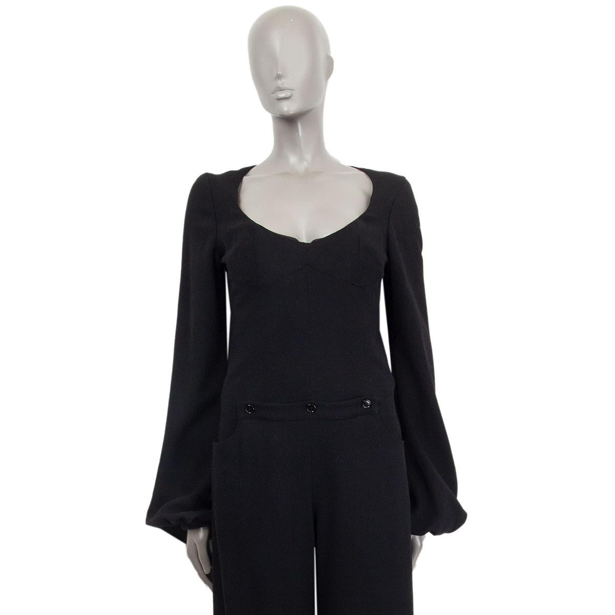 authentic Alexander McQueen wide-leg jumpsuit in black wool (85%) rayon (9%)  cotton (4%) silk (2%) with an attached bustier, kangaroo-pocket in the front, and bell-sleeves. Lined in black silk (100%). Closes with a concealed zipper in the back. Has
