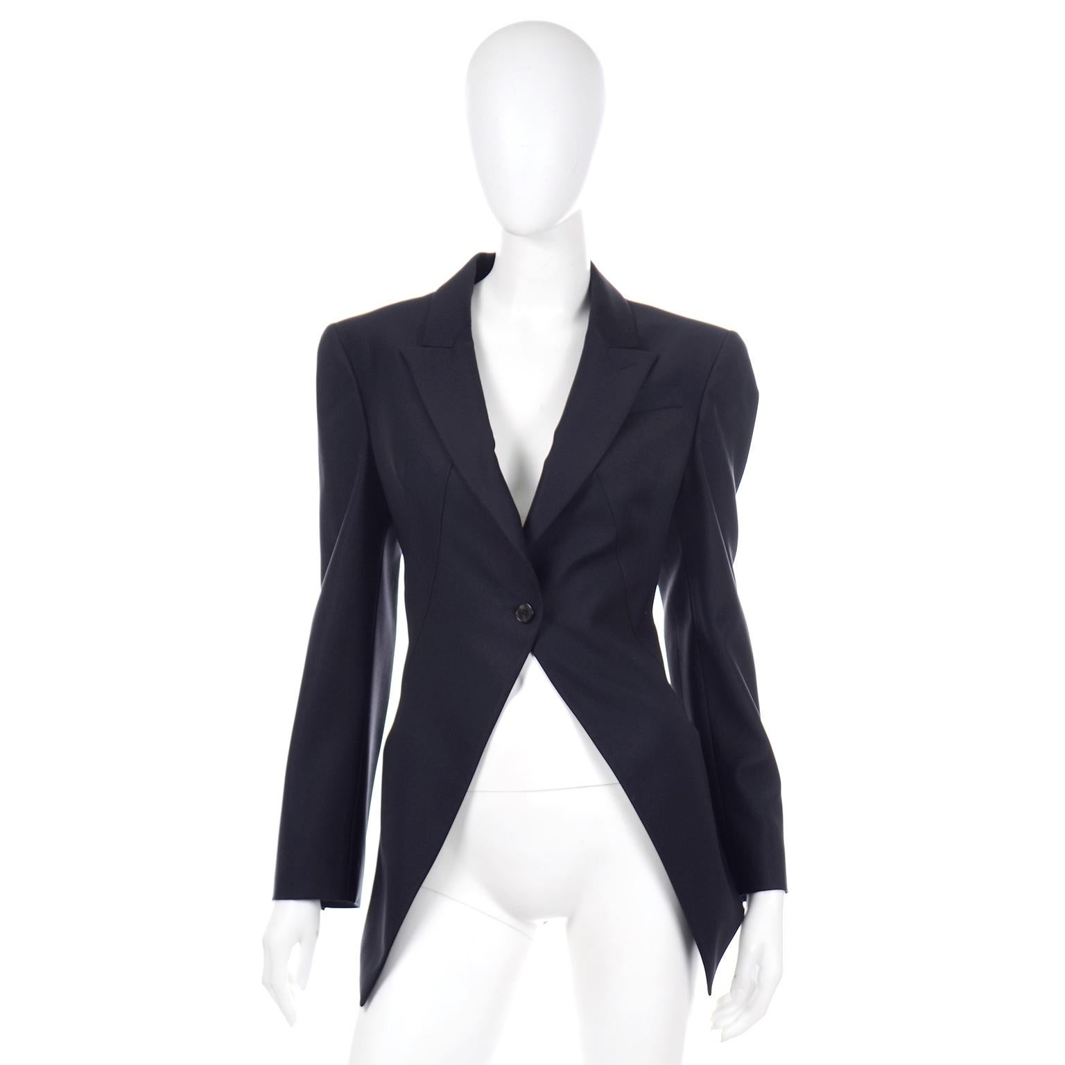 This is a 2011 vintage Alexander McQueen black wool cutaway tuxedo style blazer with pointed lapels. We love the tailoring in this beautiful jacket and can think of a million ways to style it with trousers, dresses or skirts! There is a single