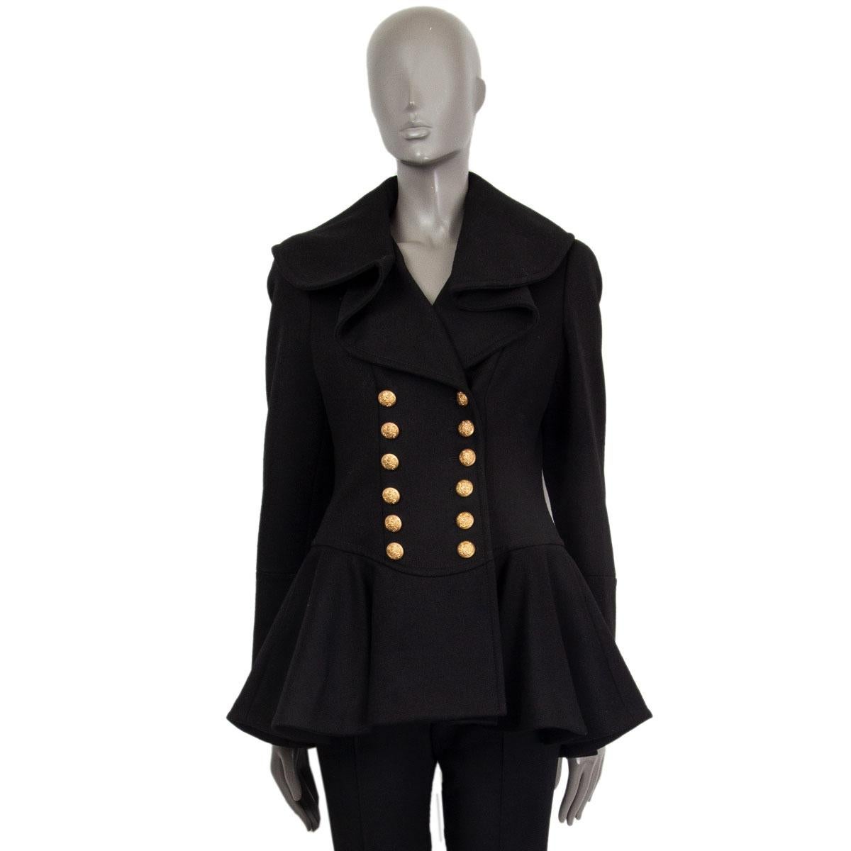 Alexander McQueen flared double breasted jacket in black wool (100%) with a ruffled wide collar and decorative gold tone embossed buttoned cuffs. Closes on the front with gold tone embossed buttons. Lined in cupro (59%) and viscose (50%). Has been