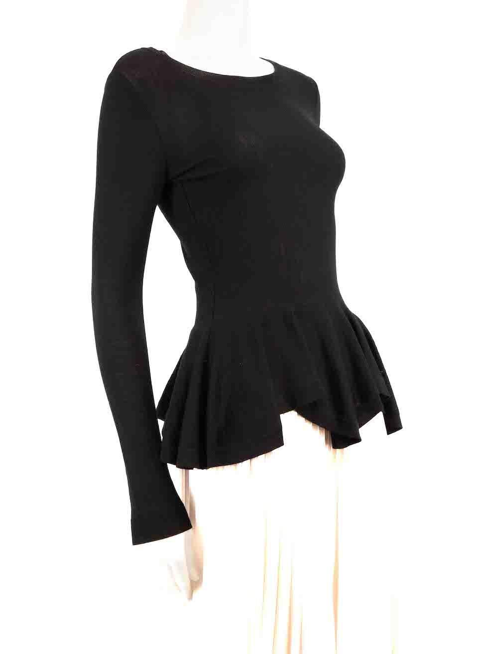CONDITION is Very good. Hardly any visible wear to top is evident on this used Alexander McQueen designer resale item.
 
 Details
 Black
 Wool
 Knit top
 Long sleeves
 Ruffled peplum hem
 Round neck
 Stretchy
 
 
 Made in Italy
 
 Composition
 100%