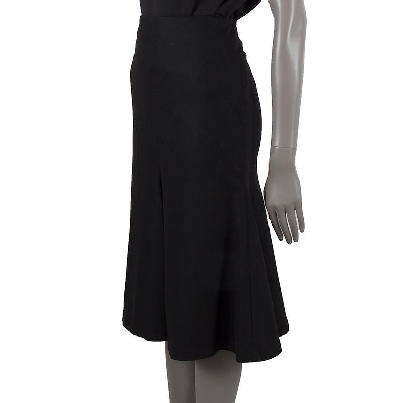 Alexander McQueen trumpet skirt in black wool (89%), nylon (9%), and spandex (2%). Closes with one hook and invisible zipper. Lined in black sateen fabric. Has been worn and is in excellent condition. 

Tag Size 44
Size L
Waist 82cm (32in)
Hips 94cm