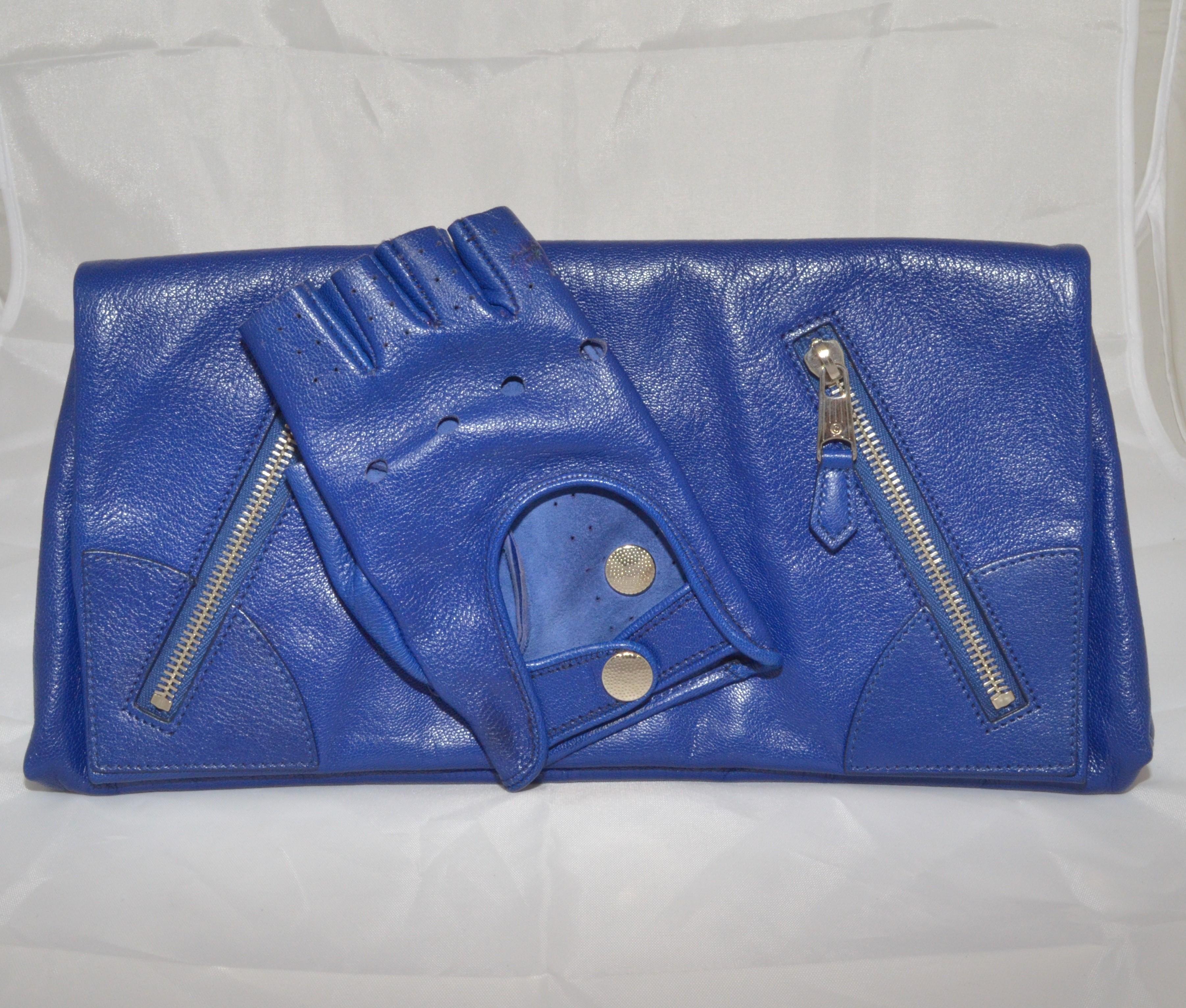 ALEXANDER MCQUEEN Calfskin Faithful Glove Clutch in blue is crafted of semi-distressed calfskin leather in a fold-over style with diagonal zippers at the front.

Measurements: 13” x 6”