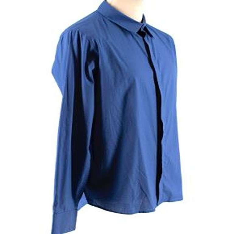 Alexander McQueen Blue Cotton Long Sleeve Shirt

-Made of soft cotton 
-Classic cut 
-Gorgeous blue hue 
-Concealed button fastening to the front 
-Pleat detail to the back 
-Buttoned cuffs 
-Timeless elegant design 

Materials:
96% cotton, 4%