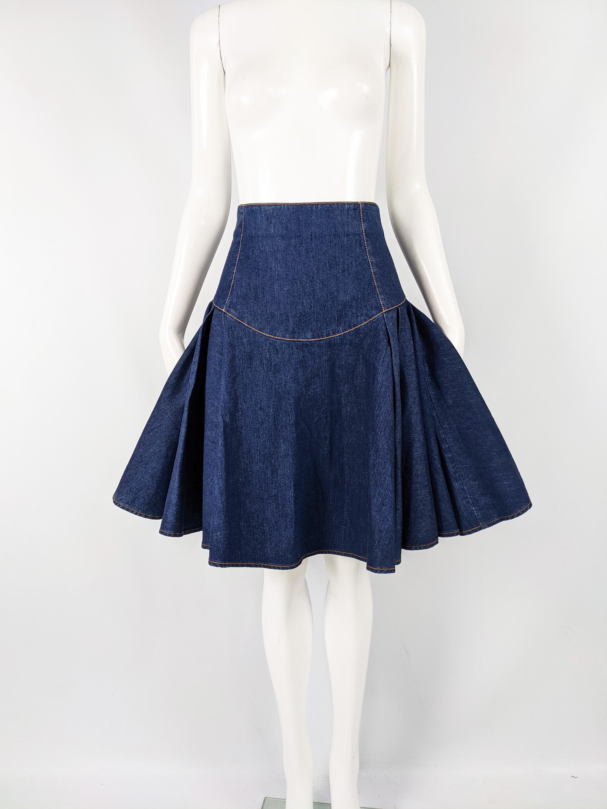 An incredible vintage Alexander McQueen skirt from the Pre-Spring Summer 2011 collection. In a blue denim with a high waist and yard of fabric gathered at the sides and the back for a flattering, high fashion silhouette. 

Size: Marked IT 38 which