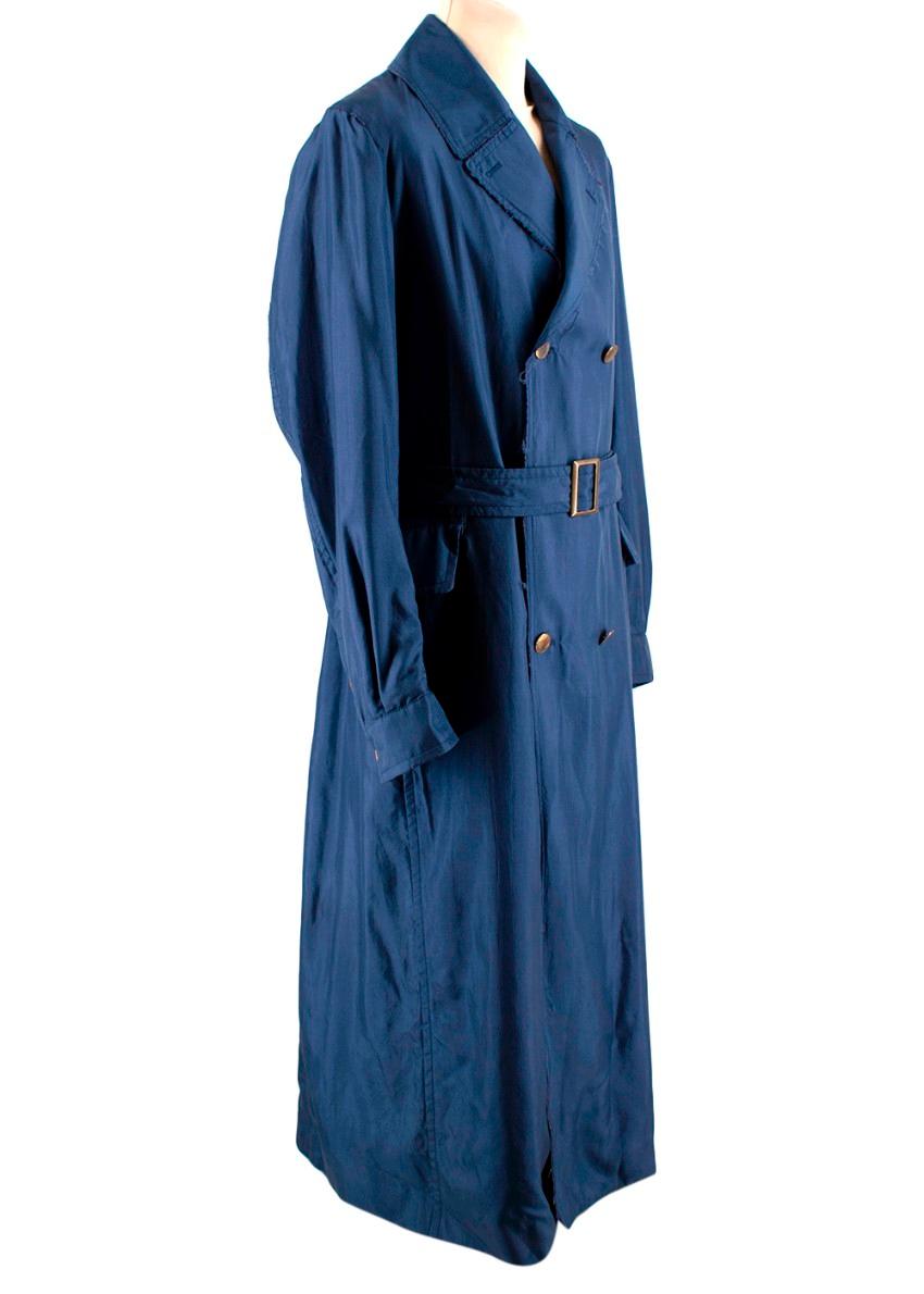 Alexander McQueen Blue Trench Coat

- Frayed edge detailing
- Button cuff fastening 
- Double-breasted button fastening
- Belted waist
- Detachable belt 
- Long sleeves
- Two flap pockets 

Materials:
- 100% Silk

Machine Washable 

Made in Italy