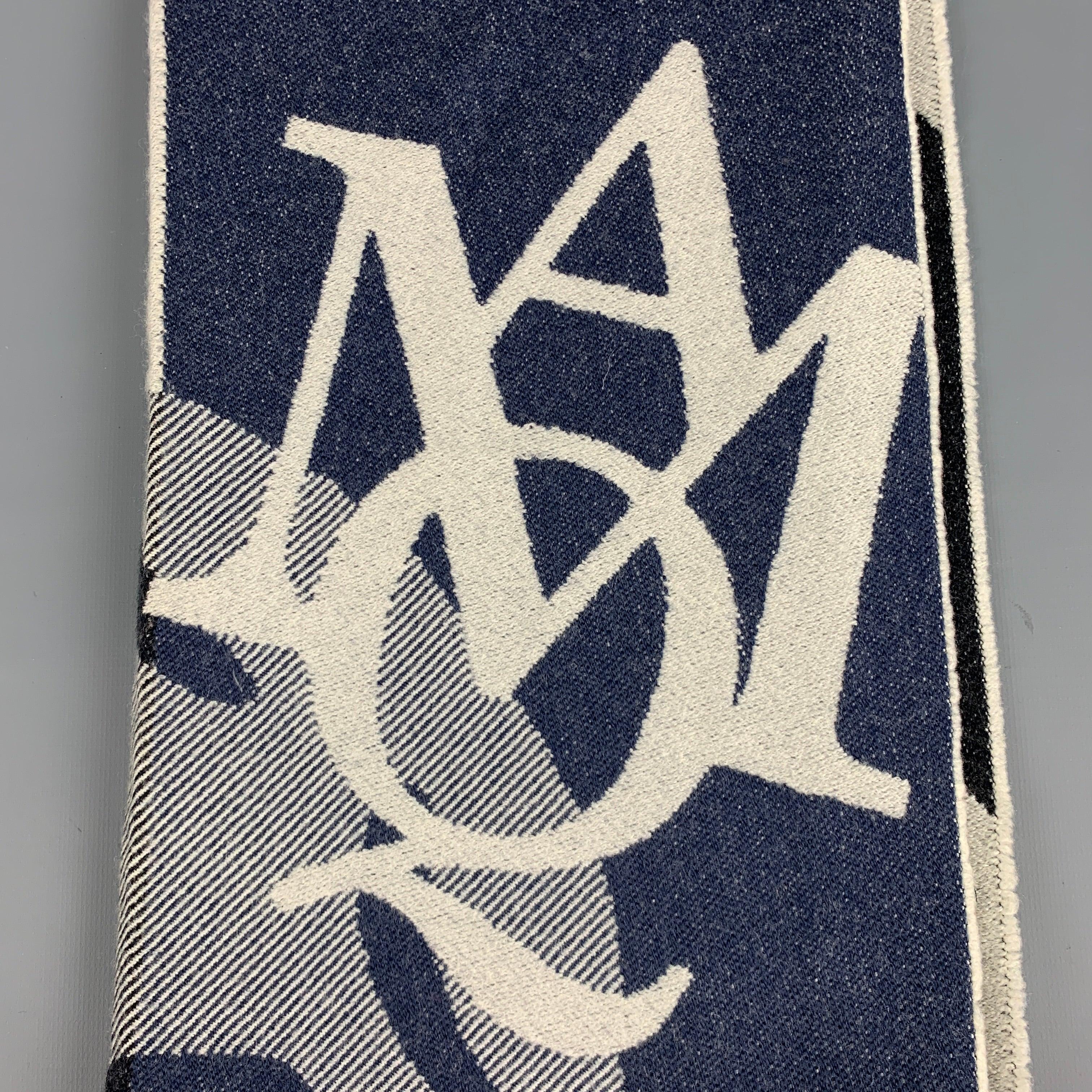ALEXANDER MCQUEEN scarf
in a blue and grey fabric featuring a reversible style, fringe, and skull and monogram design. Made in Italy.Excellent Pre-Owned Condition. 

Measurements: 
  71 inches  x 18 inches 
  
  
 
Reference No.: 128408
Category:
