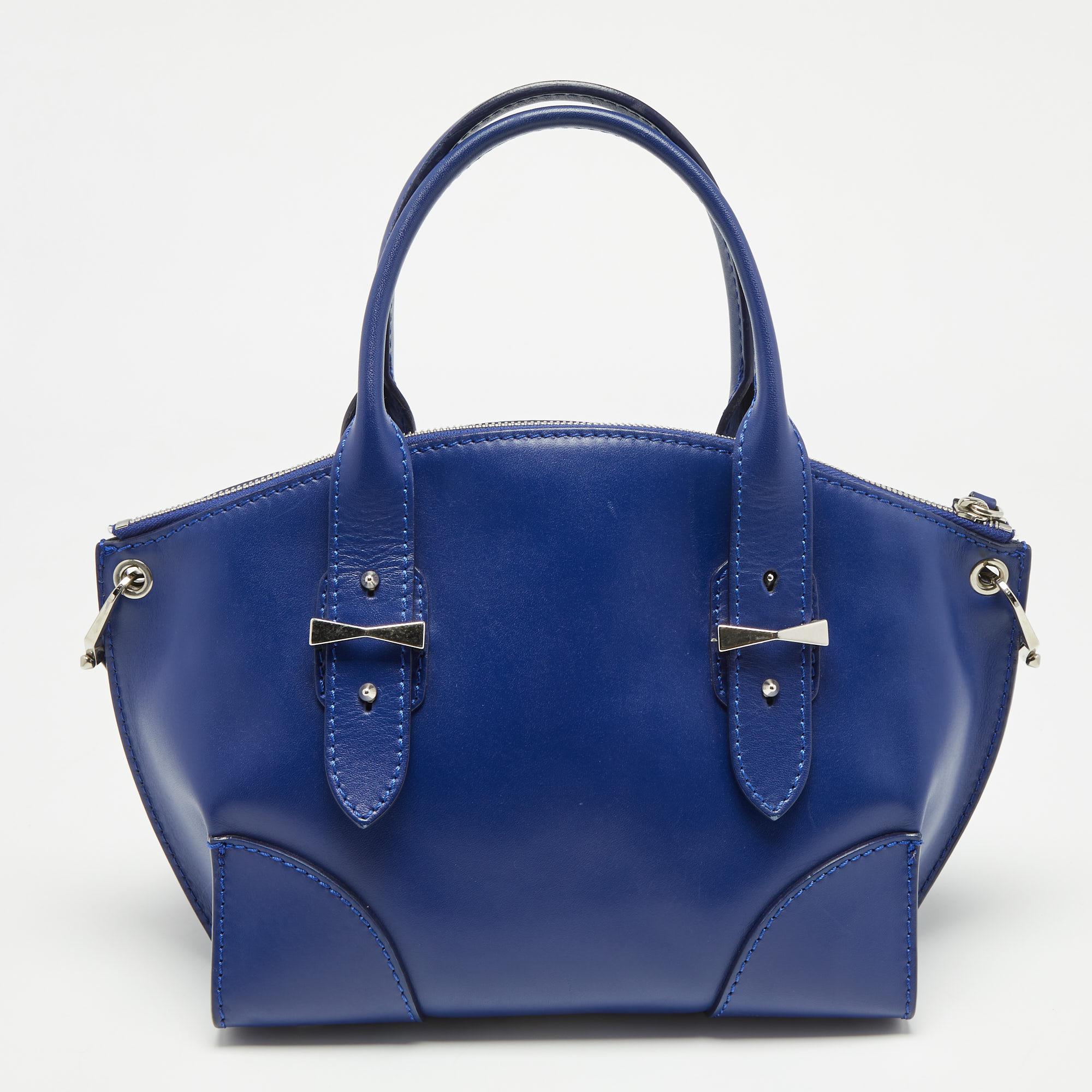 This Legend tote from Alexander McQueen is great for everyday use. It is designed using blue leather, which is embellished with silver-tone hardware. It showcases dual handles and a fabric-lined interior. This tote will make you look classy and