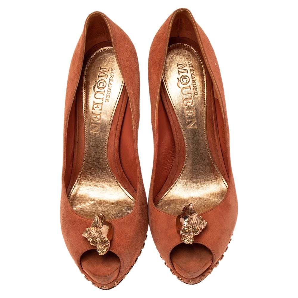 If you are someone who has a love for things that are edgy and unique, then Alexander McQueen's designs are perfect for you. These McQueen pumps are anything but dull. Luxuriously crafted from suede, they feature gold-tone skull motifs over the peep