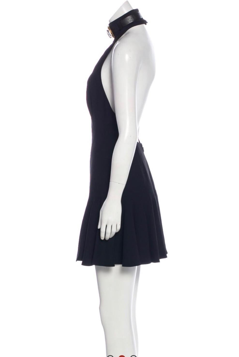 Alexander McQueen black halter mini dress with buckle detail. Condition : Excellent. 
Size S/ US 4/ IT 40
26