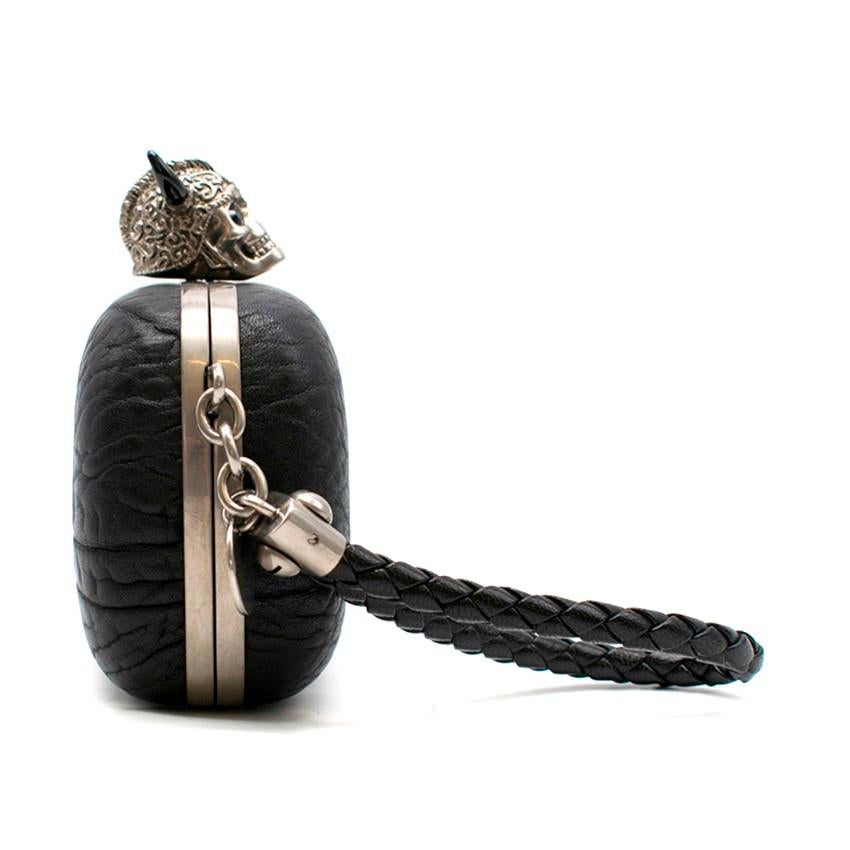Alexander McQueen Bull Warrior Skull Clutch

- Black clutch bag
- Skull warrior embellished
- Push class fastening
- Braided leather wrist strap
- Silver-tone hardware
- This item comes with the original dust bag.

Please note, these items are