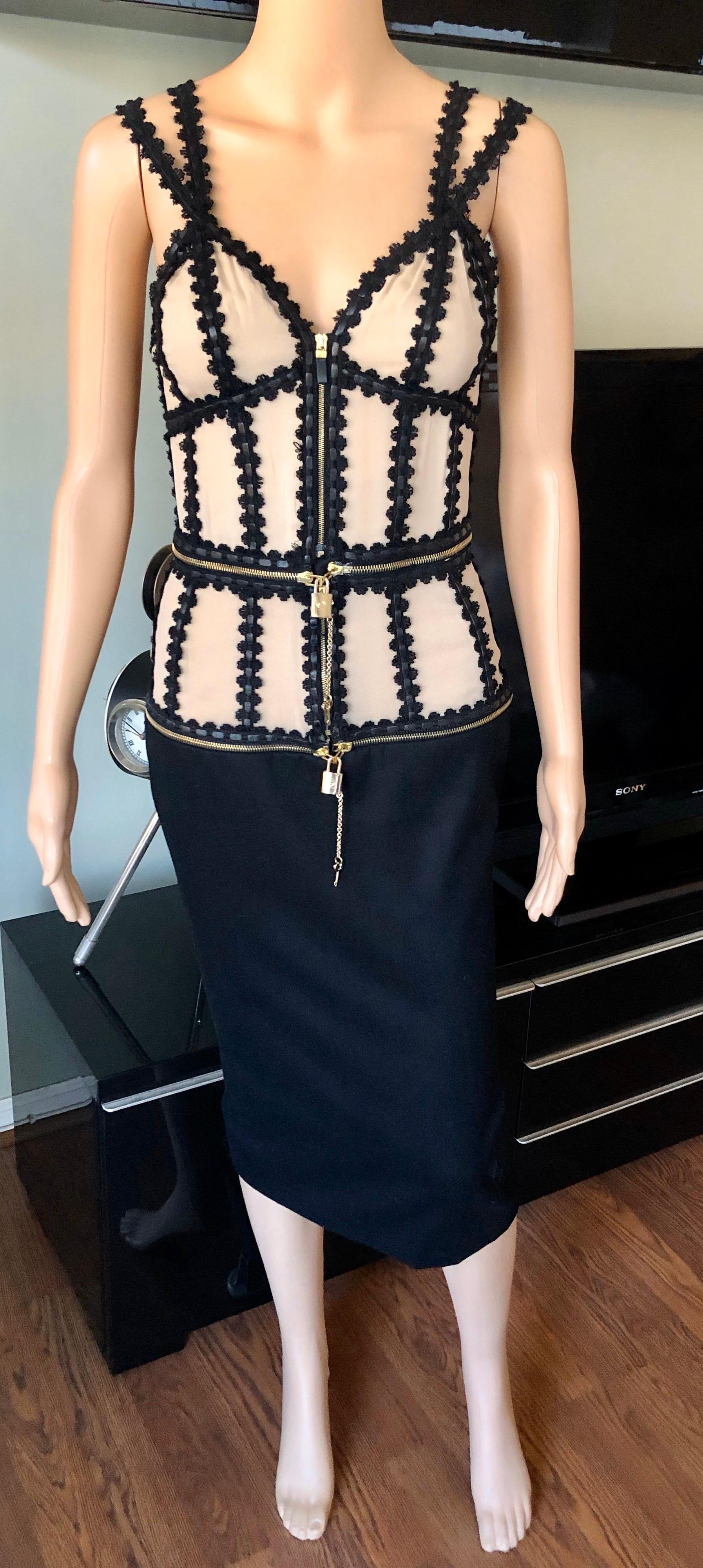 Alexander McQueen Vintage c.2003 Zipper Lock And Key Dress IT 40

Alexander McQueen black and tan dress with plunging neckline, lace trim, logo lock and key embellishments at bodice and zip closure at front.