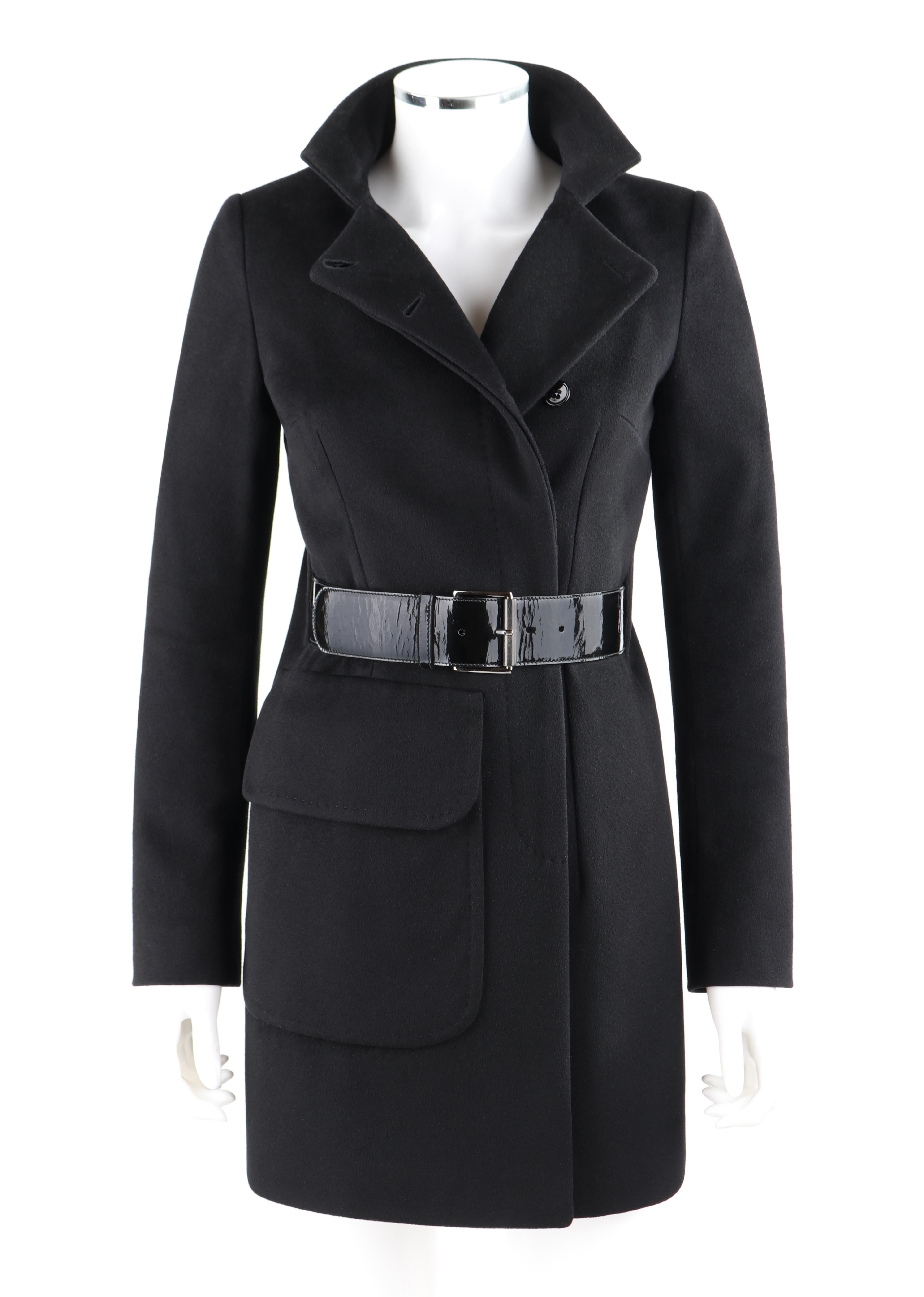 ALEXANDER McQUEEN Wool/Cashmere Coat with hand stitching, covered button placket, slits for patent leather belt.

ALEXANDER  McQUEEN c.2007 Black Wool/Cashmere Women's Coat

Brand / Manufacturer: Alexander McQueen
Designer: Alexander