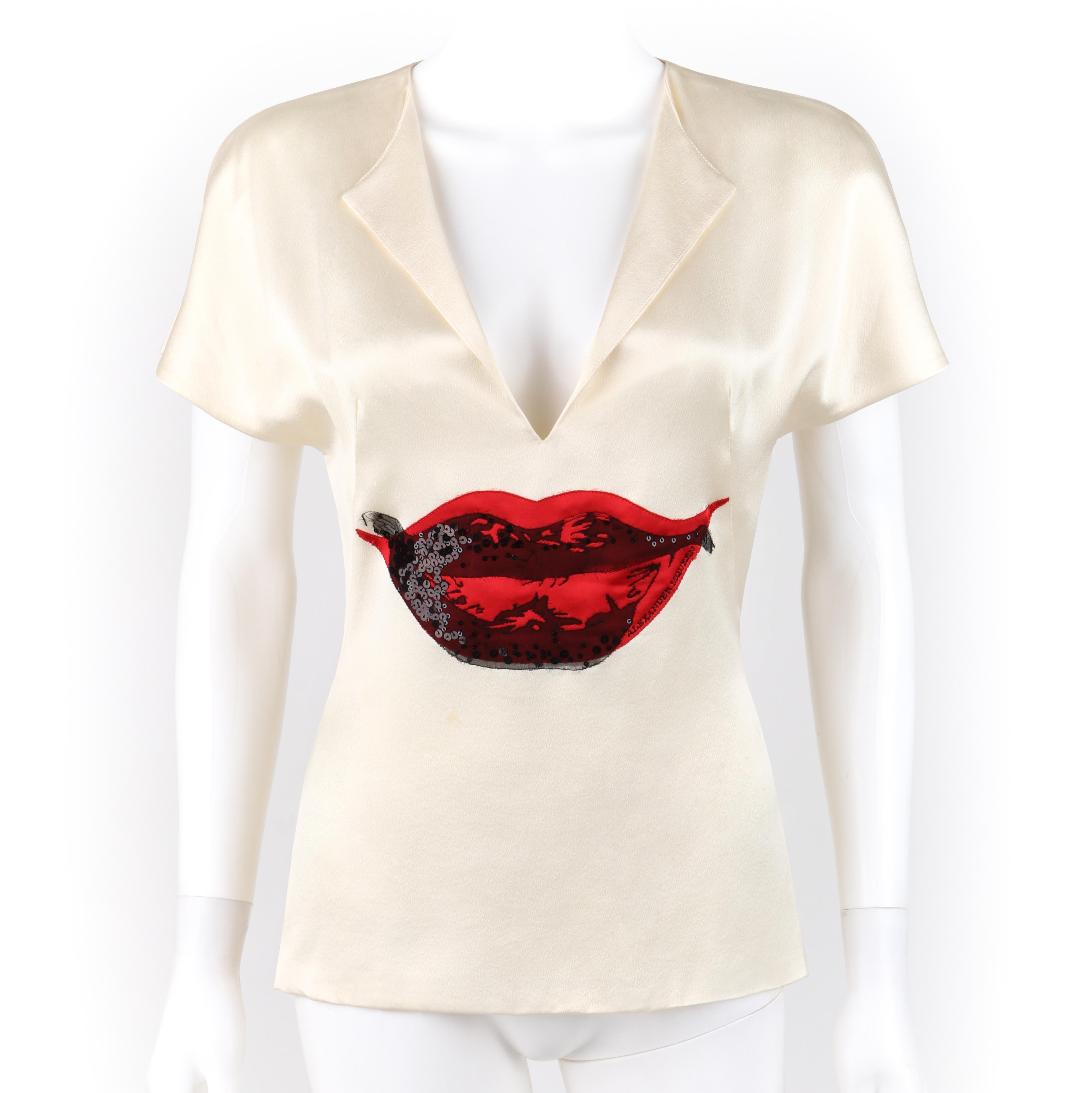 ALEXANDER McQUEEN c.2009 Ivory Red Black Silkscreen Sequin Lips V-Neck Blouse
 
Brand / Manufacturer: Alexander McQueen
Circa: 2009 
Designer: Alexander McQueen 
Style: Blouse top
Color(s): Base: ivory; Lips: shades of red, black
Lined: No
Unmarked