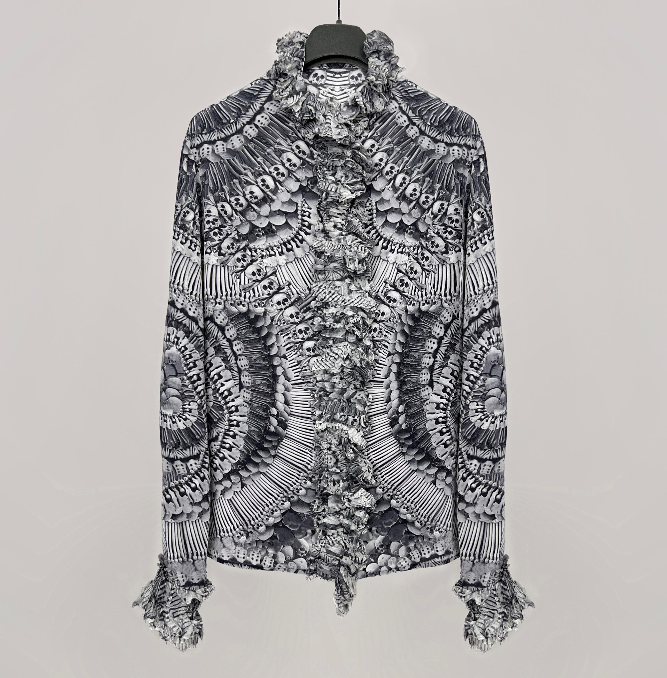 Alexander McQueen catacombs skull printed blouse  collection: Pre-Fall 2010
 
size 42
made in Italy
color: gray/black
condition: gently used
composition: 100% silk
 
Measurements:
chest ~ 49 cm
sleeve ~ 63 cm
sleeve (from pit to cuff) ~ 48