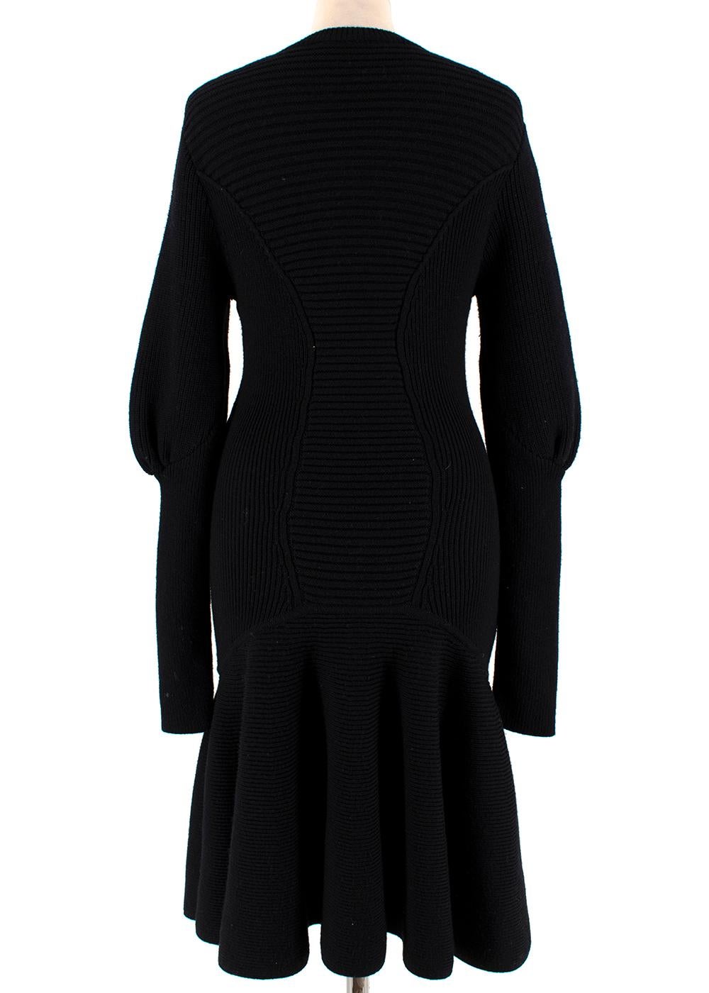 Alexander McQueen Knitted Black Peplum Dress

- Tight fitted around the upper body
- Chunky-knit with horizontal stripe
- Medium weight
- Peplum skirt
- Round neckline
- Puff sleeves & slim cuffs
- Warm blend of wool 

Fabric Composition:
100% Wool