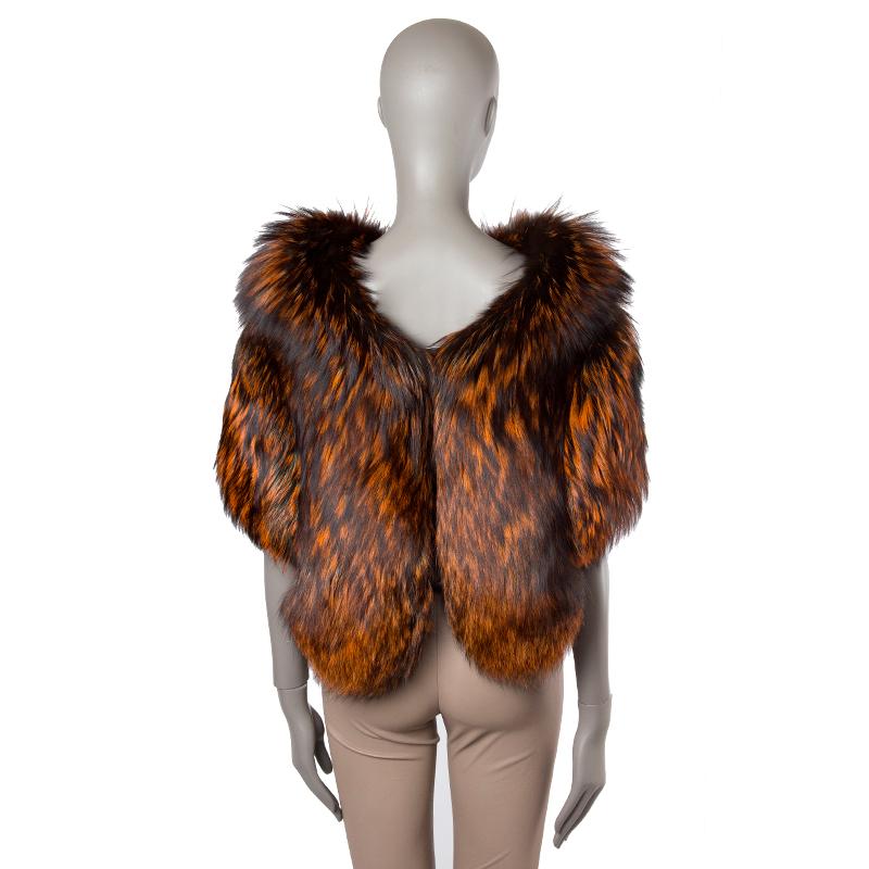 Alexander McQueen Vest in orange, forest green, and black dyed fox fur with open seams held by straps. Closes with one hook on the front. Lined in black silk (100%). Has been worn and is in excellent condition.

Size M
Shoulder Width 42cm