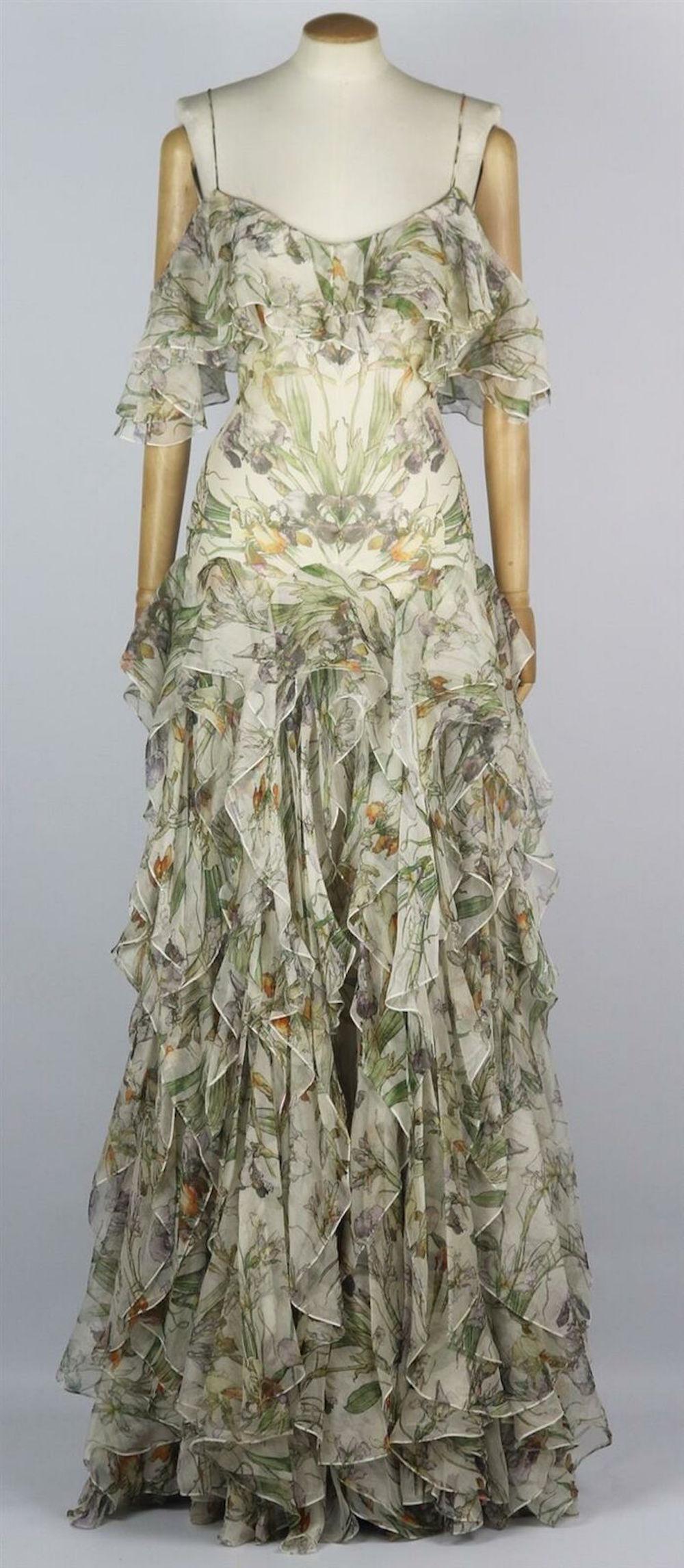 This Alexander McQueen dress is filled with exaggerated volumes and floral prints, cut from airy silk-georgette, this dress is patterned with beautiful blooms and has a cold-shoulder neckline that's secured by slim straps, it's detailed with ruffled