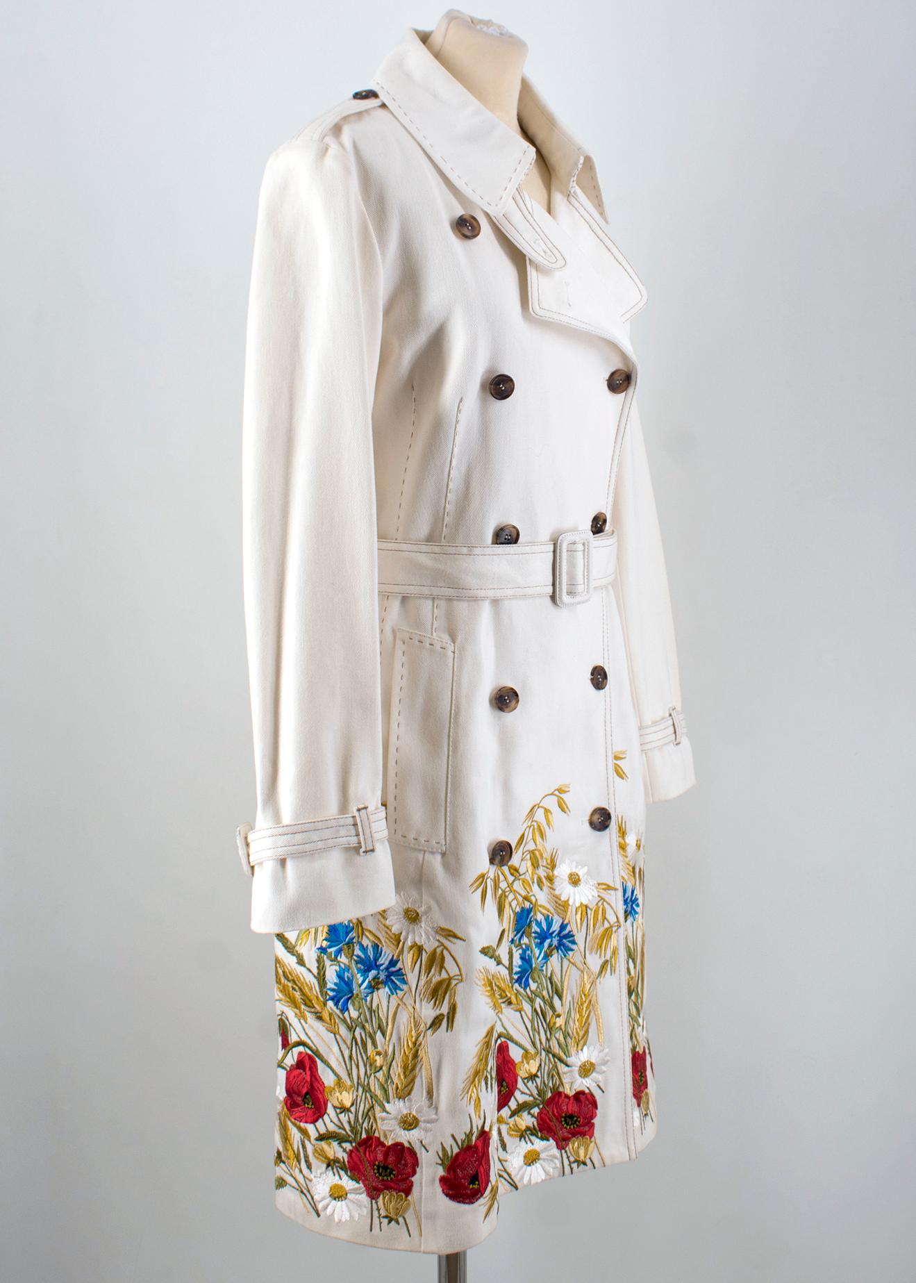 Alexander McQueen Cream Long Denim Trench
- Long belted trench coat in a cream denim material
- With multicoloured floral applique along the bottom of the coat
- Contrast stitching 
- Tortoise shell buttons 

Condition: 9.5/10

Please note, these